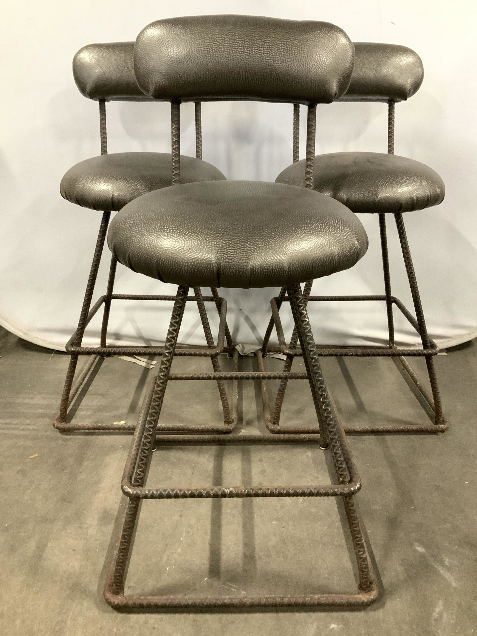 Set 3 Iron Frame Stools, industrial modern: Stools appear to possibly be leather. Frames of stools appear to be iron. Each stool is significantly weighted. Stools measure approx 42 inches tall 19 inches wide& deep. Stools, iron stools, bar stoo