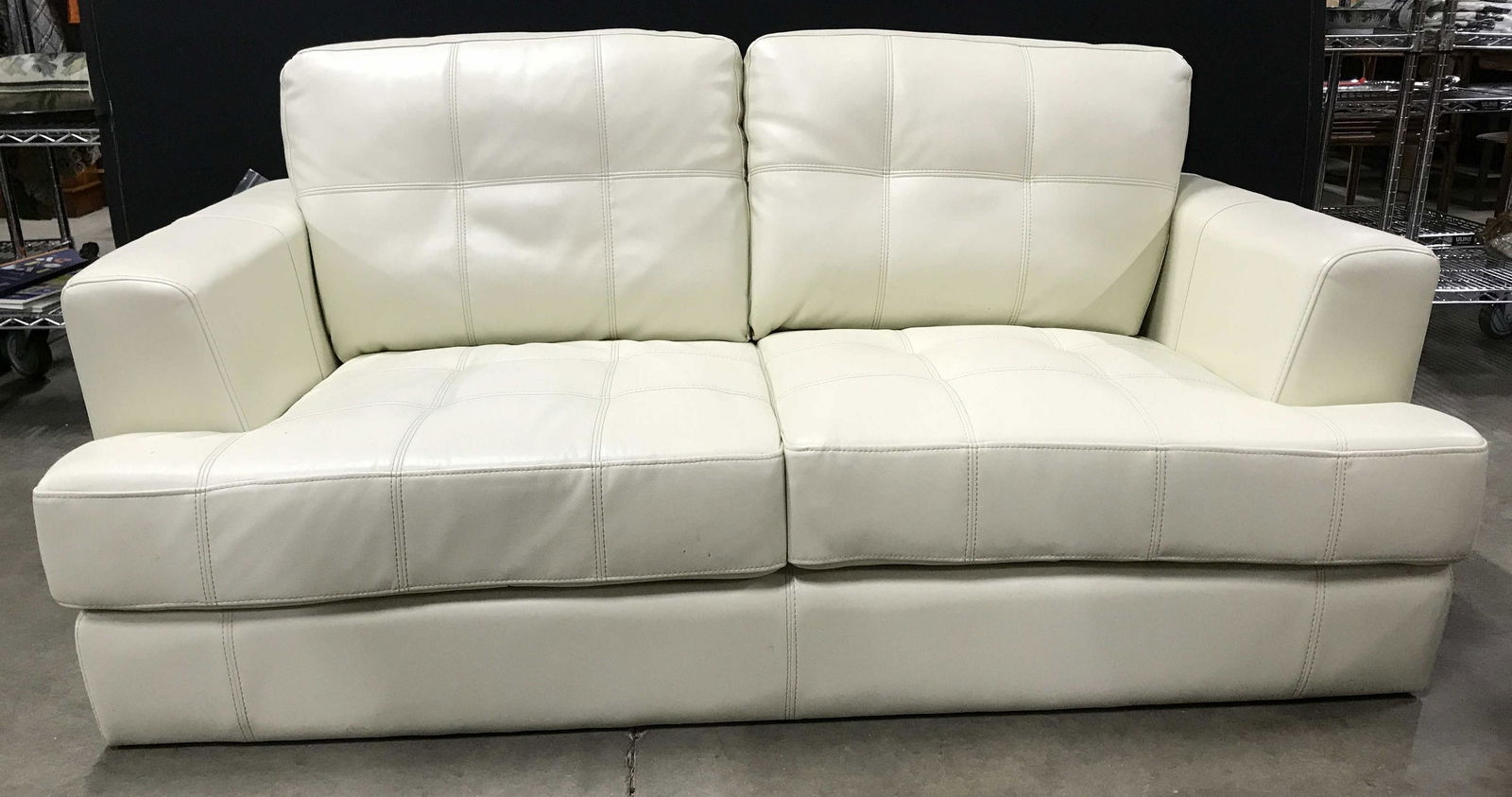 COASTER Cream Toned Leather Love Seat: Tag attached to love seat reads COASTER FINE FURNITURE. Sofa is cream toned. Measures approximately 66 inches long 32 inches tall 36 inches deep. Appears to possibly be genuine leather. sofa, loveseat