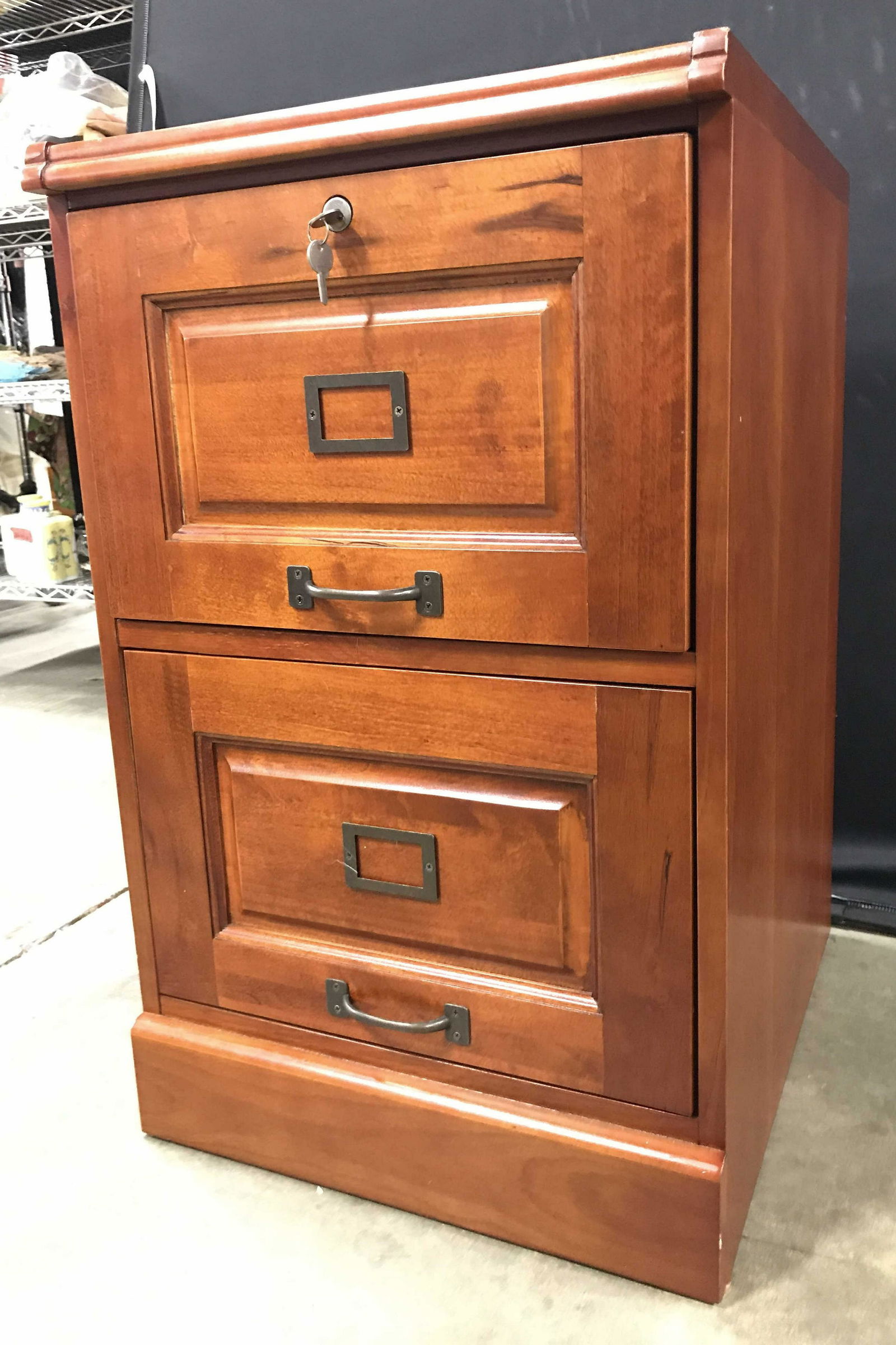 COASTER Carved Wooden File Cabinet: Backside of piece has tag which reads COASTER FINE FURNITURE. Piece has 2 drawers each with metal handles. Drawers includes keys. Piece is mahogany toned, possibly mahogany. Measures approximately 31