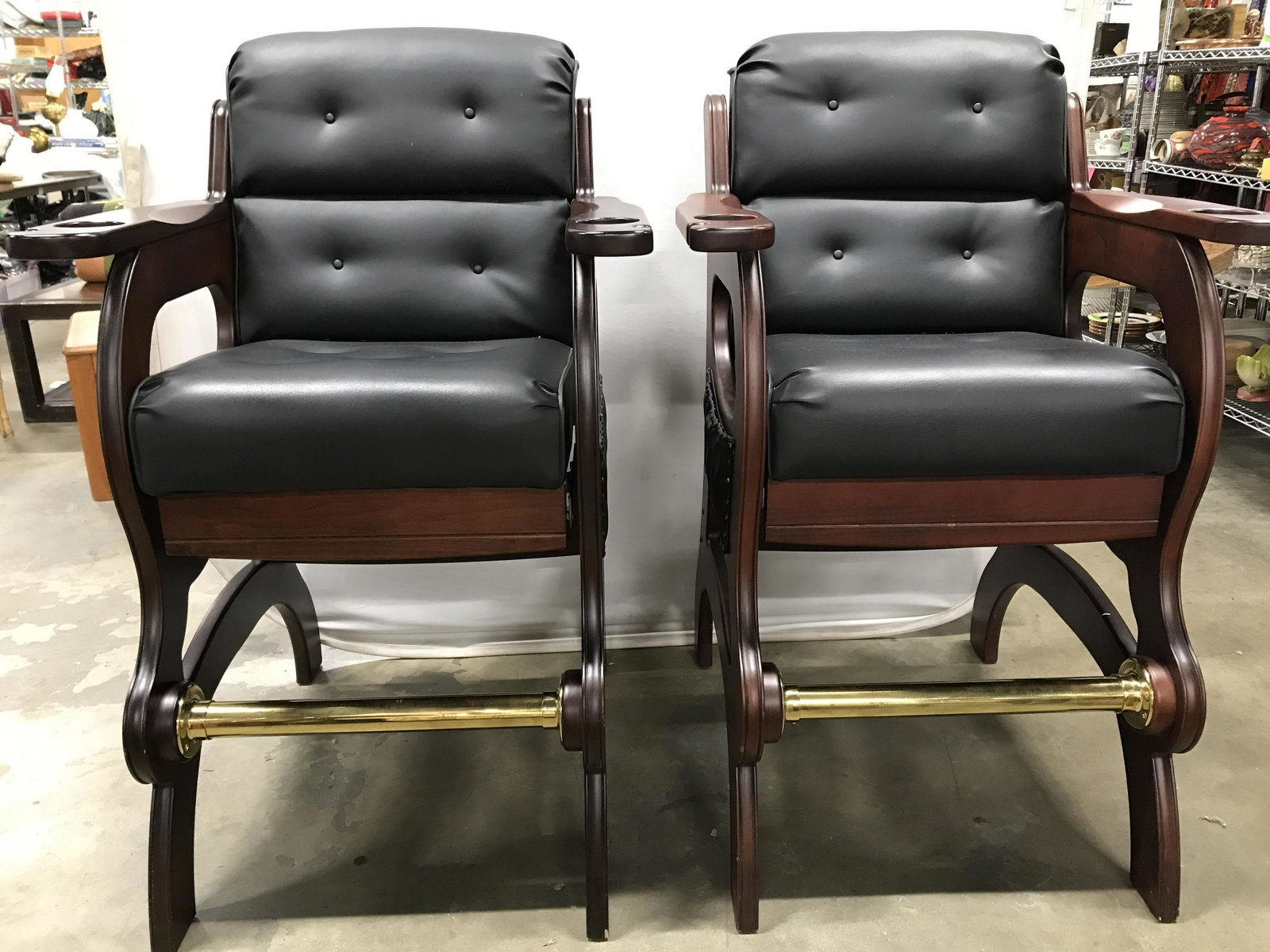 Pair MIKHAIL DARAFEEV Reclining Billiard Chairs: Backside of one chair is marked MIKHAIL DARAFEEV. Lot includes 2 billiard chairs. Each have carved wooden frame and are upholstered with black toned leather. Chairs have pockets on sides with nailhead