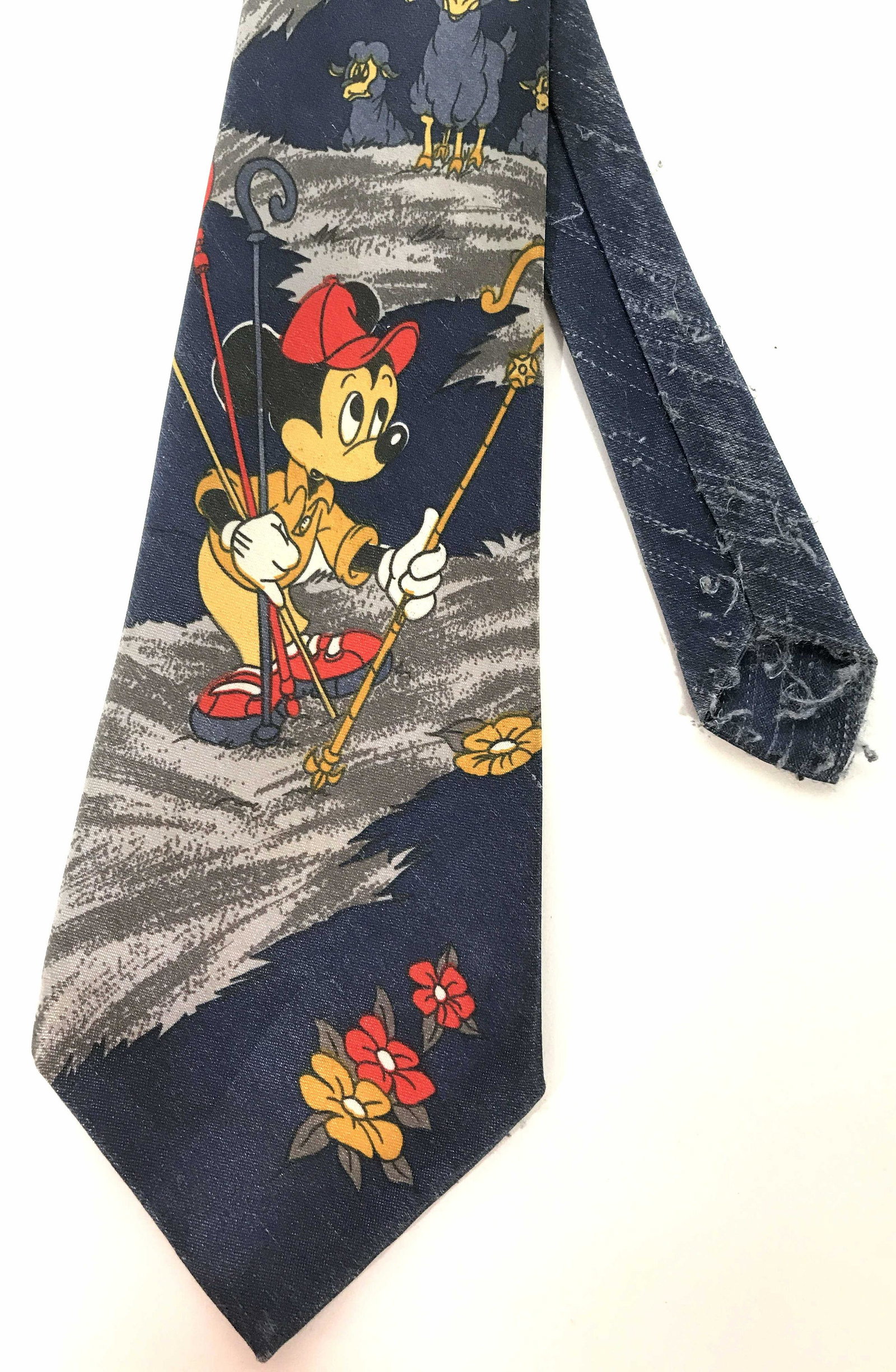 Vintage MASTER MAN Disney Mickey Mouse Necktie: Vintage necktie. Features MICKEY MOUSE acting as a shepherd. The ties label reads MASTER MAN. Wear is consistent with age and use, in need of repair. Measures approx 57.5 inches H, and 3.75 inches W. 