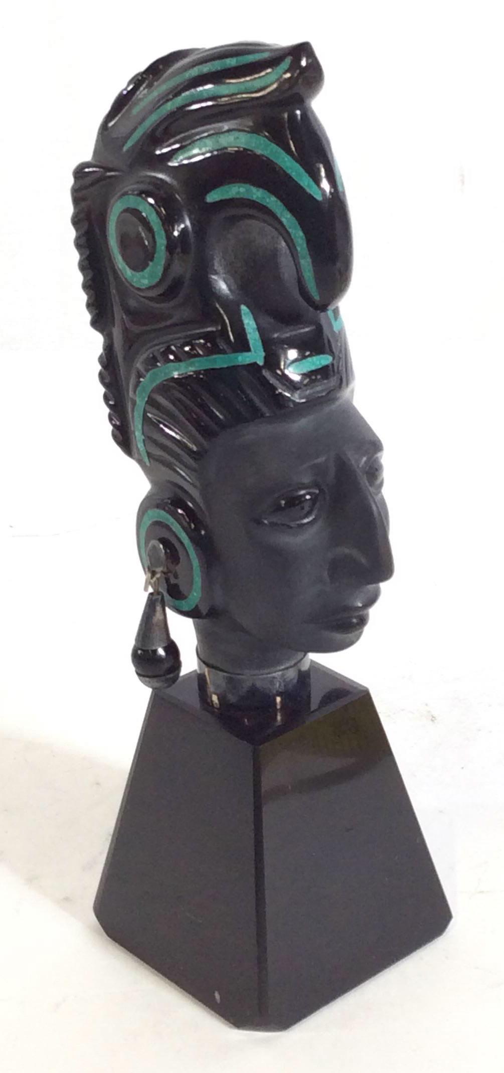 Carved Natural Stone Mayan Figural Statue, Mexico: Man Figural Chief wearing a Quetzal or Bird Headdress And Earrings. Natural stone, possibly Onyx. Parts of stone are polished and hand painted, facial features all un-polished natural stone. Impressed