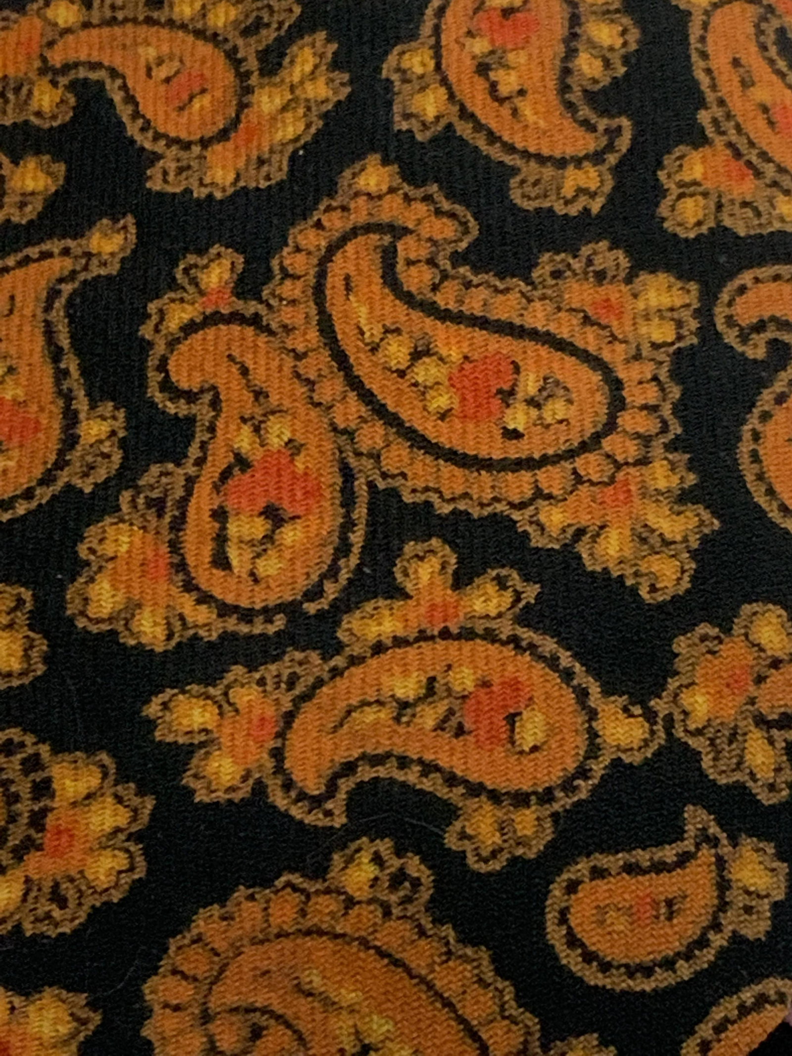 Two Vintage Paul Stuart Ties: Two fall tone ties, earth tones, vintage ties, reds and oranges, one label reads Paul Stuart, tie with a red floral pattern and one label reads Paul Stuart, with an orange paisley patterns, Vintage, m