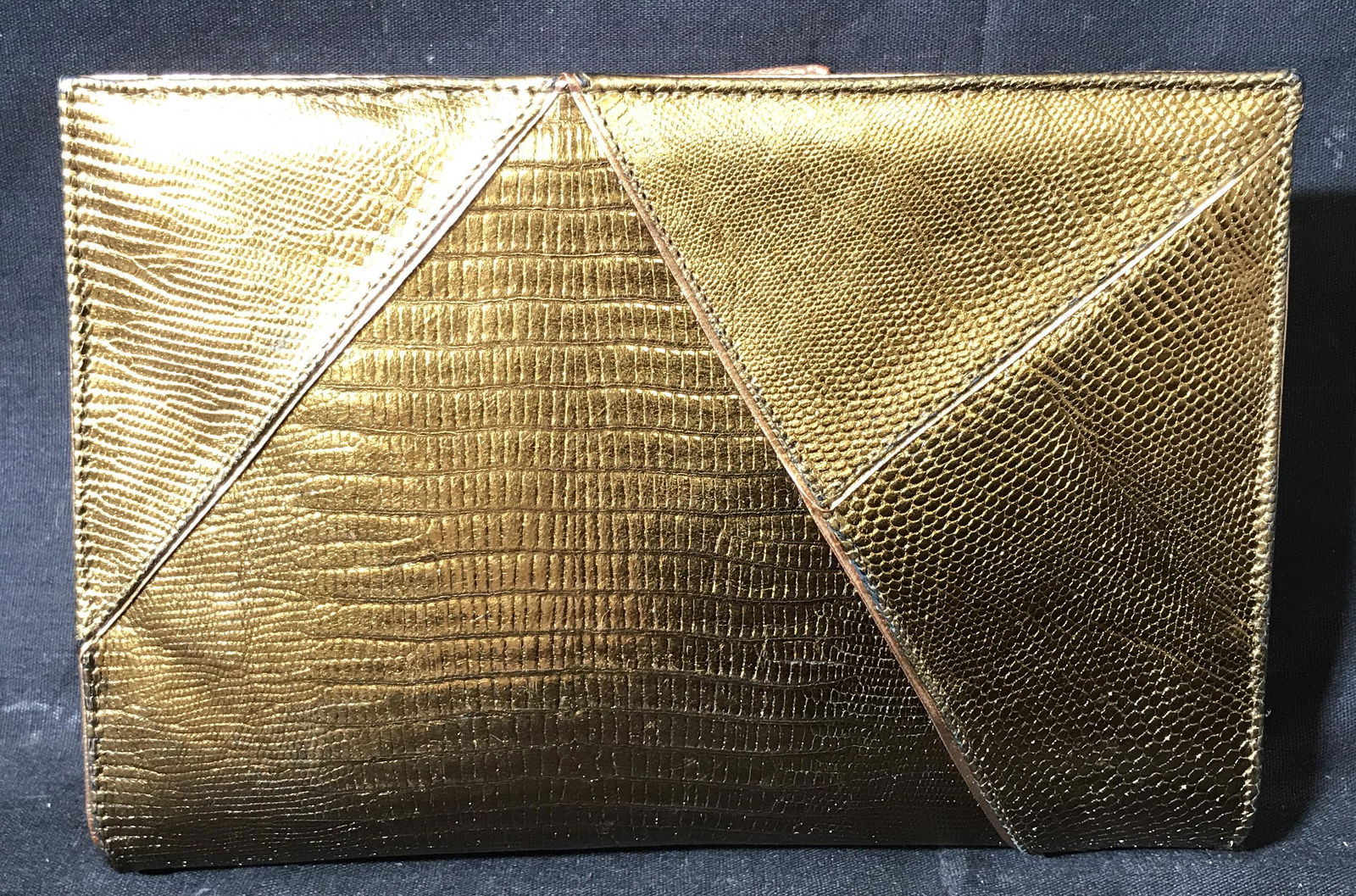 Susan Bennis Warren Edwards Purse: Susan Bennis Warren Edwards purse, purse has a gold snake skin design, made of a gold toned pleather material, interior made of a grey pleather fabric, bag measures 8 inches long, label to interior re