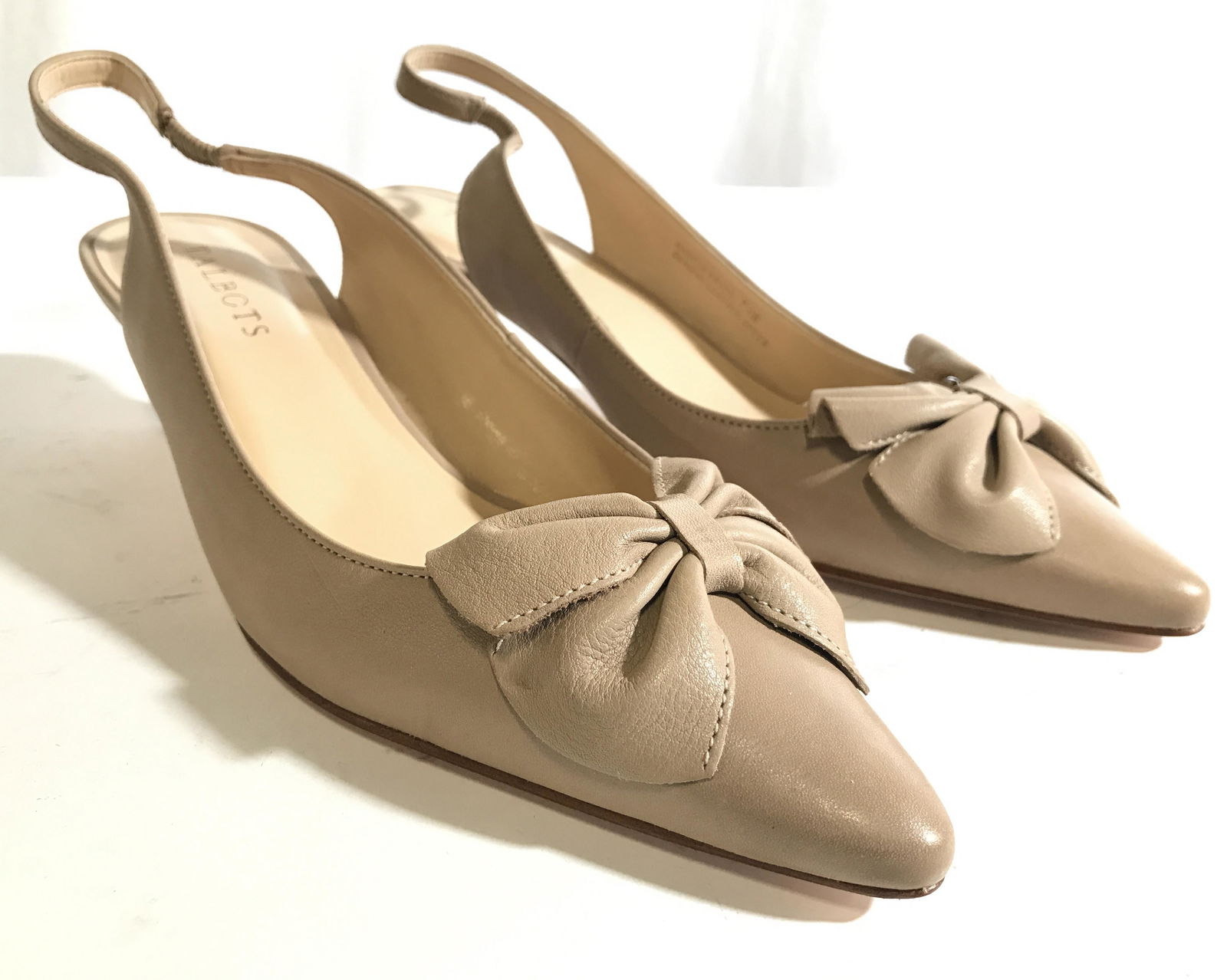 TALBOTS Women’s Leather Heels Size 7.5: Soles of heels read TALBOTS. INTERIOR reads MADE IN BRAZIL GENUINE LEATHER UPPER. Shoes have 2 inch heels and leather soles. Shoes are tan toned. Each have pointed toes. Both have bow shaped shoe orna