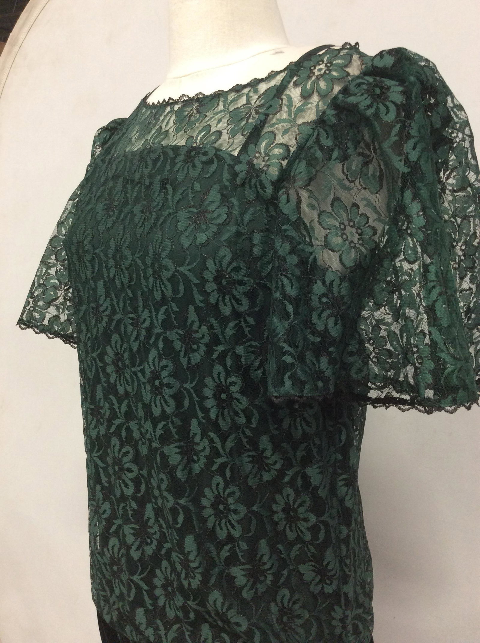 Labeled Jane Schaffhausen Bell France Lace Dress: Designer to the stars, this dress is a vintage Jane Schffhausen Belle France c. 1980s dress. See through lace, dark green with attached slip dress. Original designer label reads Jane Schaffhausen Bell