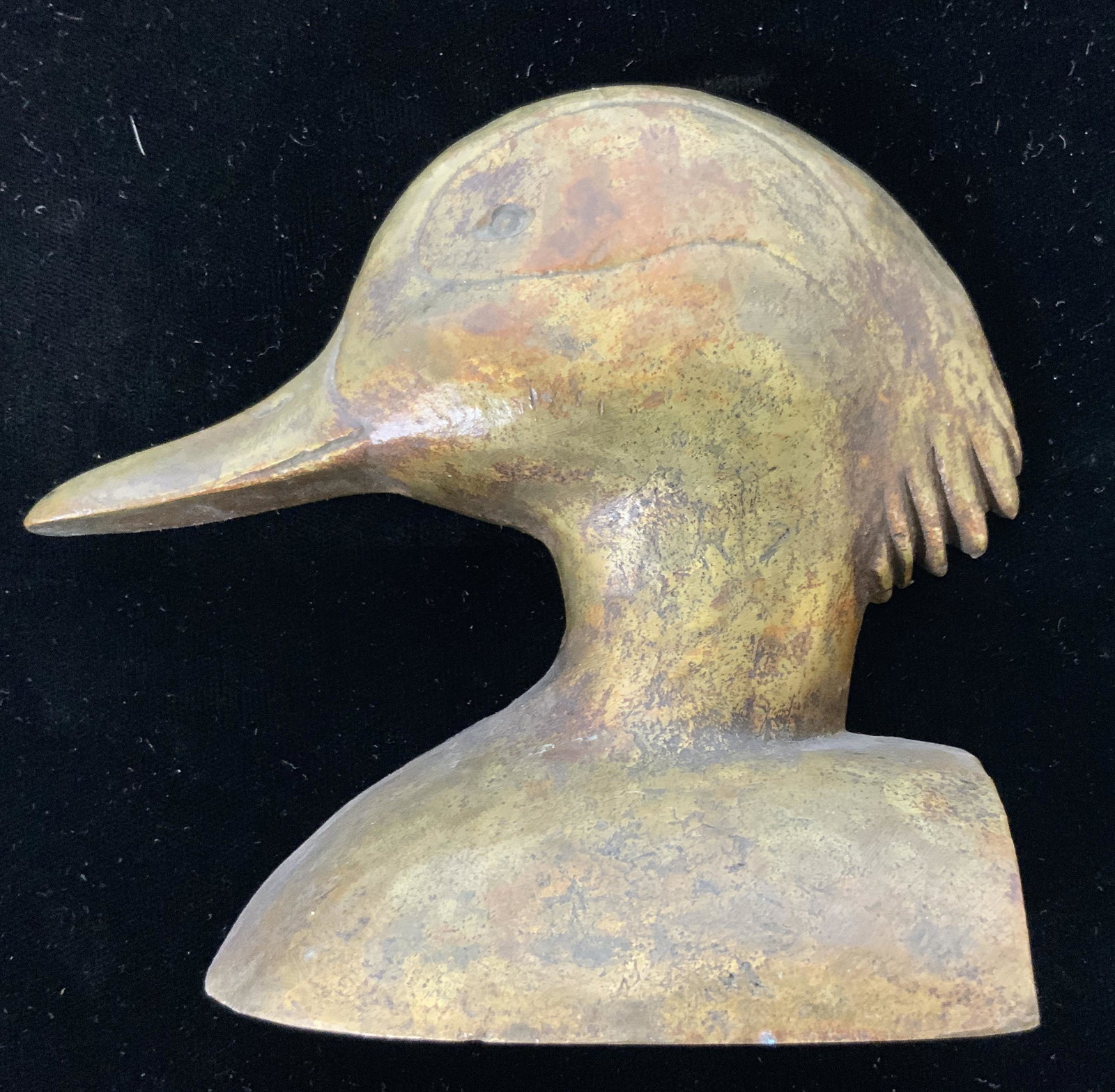 Gold Toned Brass Duck Bookend: Bookend is gold toned and brass. Piece has facial features. Piece measures approximately 4 inches tall 4.5 inches long, 1.75 inches deep. cast metal, decorative arts and accessories, tableware, tablet