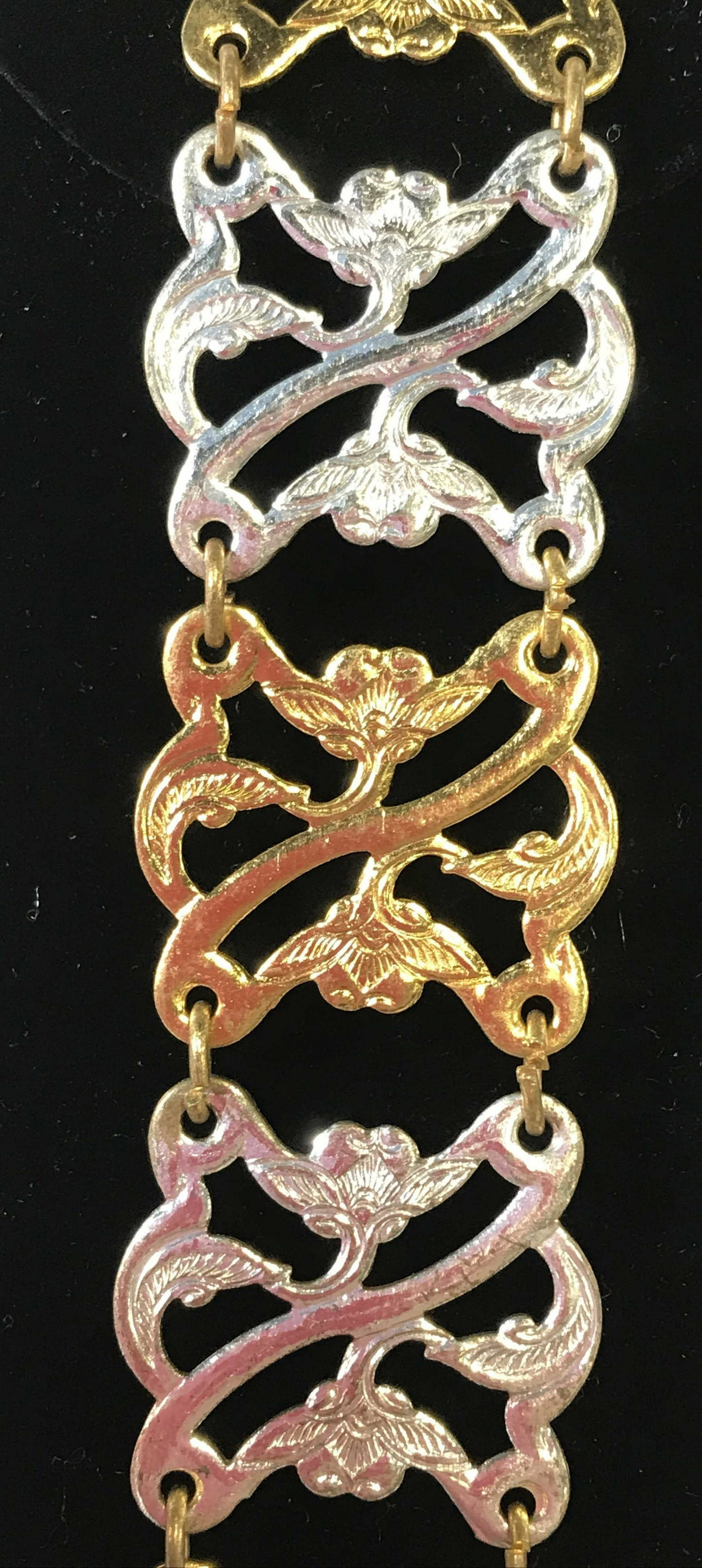 Two Toned Embossed Floral Metal Belt: metal openwork beaded belt, alternating pierced gold tone and silver tone metal links, art nouveau style, 32.5 in long. Needs buckle repair, or up cycle. stamped with asian / Thai characters. Ladies F