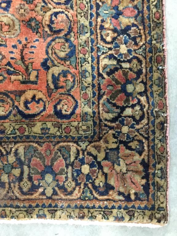 Antique Handmade Persian Wool Rug: Rug is handmade and wool. Piece contains intricate multi toned floral detail. With tones of teal, coral brown, navy & beige. Piece measures approx 75 inches long 50 inches wide. Contains some wear and