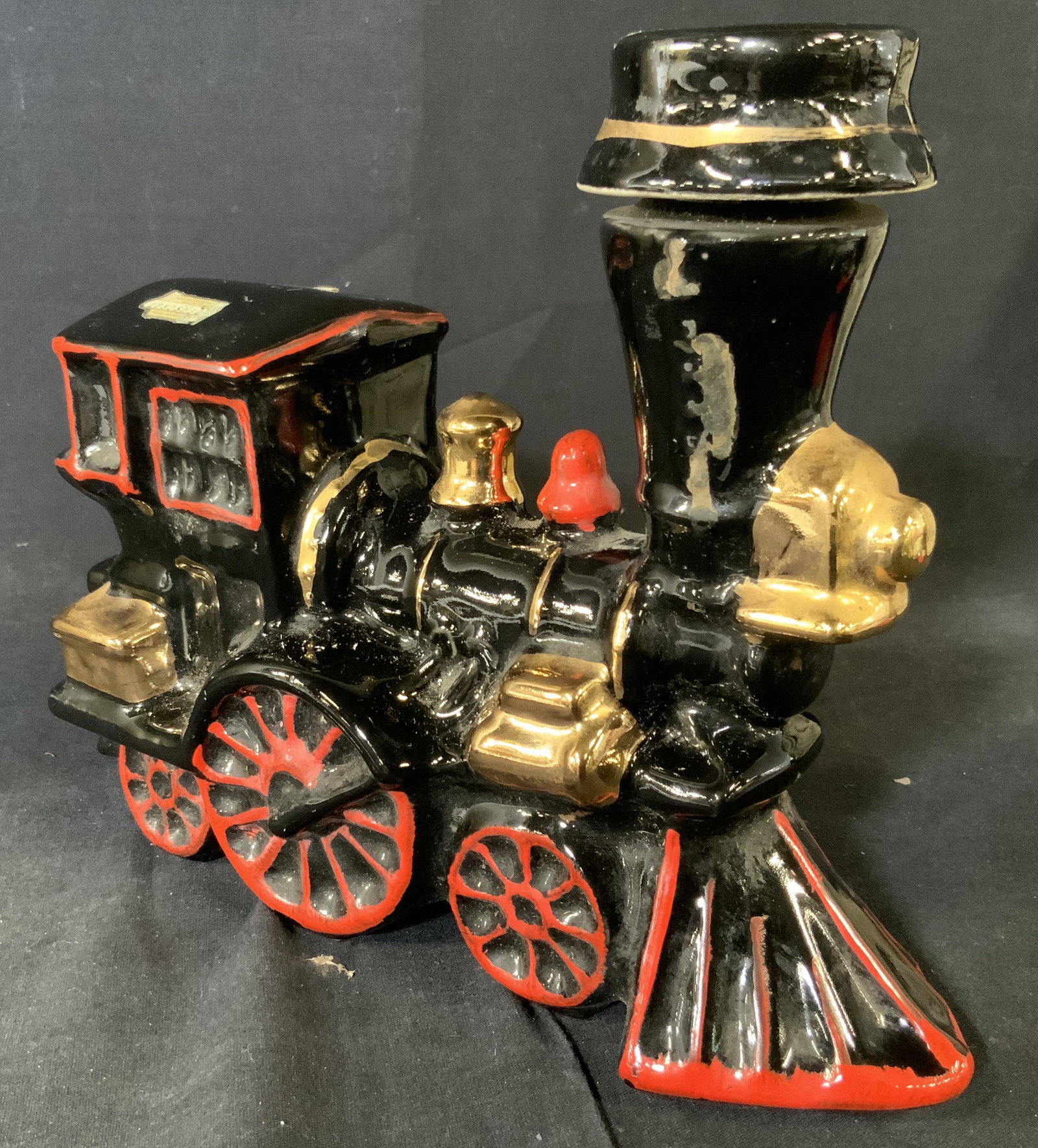 Antique Ezra Brooks Train Figural Decanter: Antique Train Figural decanter, label on side reads Ezra Brooks 12 years old. ceramic body with metal accents and painted with enamel paint, limited edition whiskey bottle, body is mostly black with r