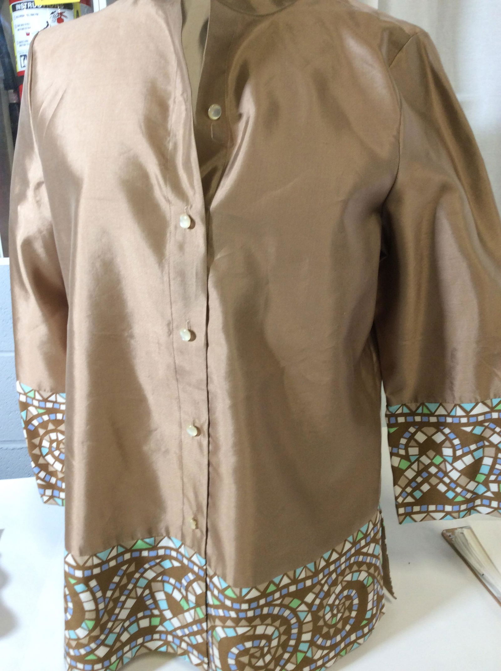 Bob Mackie Silk Button Down Blouse: Size Small. Mosaic motif hems, Designer Tag Reads Bob Wearable Art + 100% silk. Boxy straight cut. Pearlescent buttons down Center. Designer Silk Blouse, Long Sleeve Blouse, Luxury Designer Bob Mackie