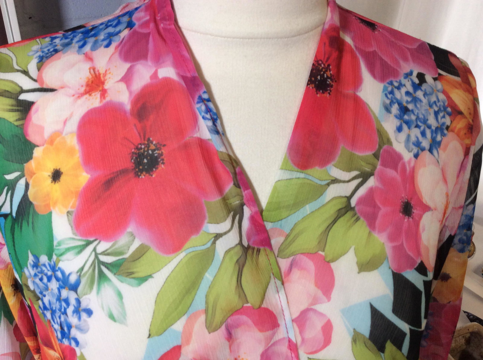 Slinky Brand Floral Cover All Blouse: Designer label Attached. Other label reads size Small, Made in USA, 100% polyester. Sheer fabric with tropical flowers. Slinky Brand, Tropical Flower Design, Long Sleeve Blouse, Cover all Blouse, Summ