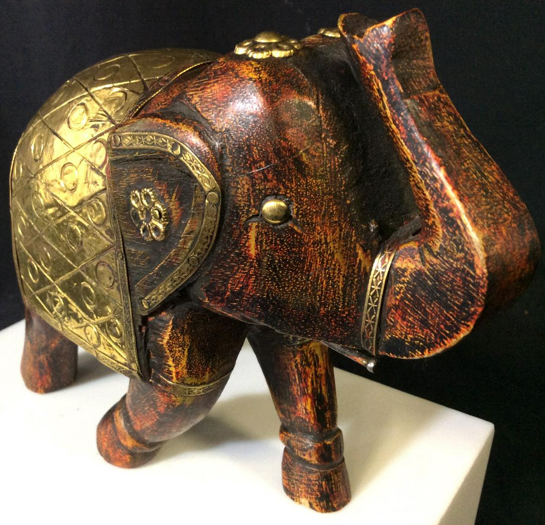 Hand Carved Ceremonial Wood Elephant Figural: Elephant Figural with Hammered and etched Brass Accessories For Ceremonial show. Hand carved and hand painted, 7 in long, 6 in tall, 3.25 in wide/ deep. Decorative Wood Elephant Figural, Ceremonial De