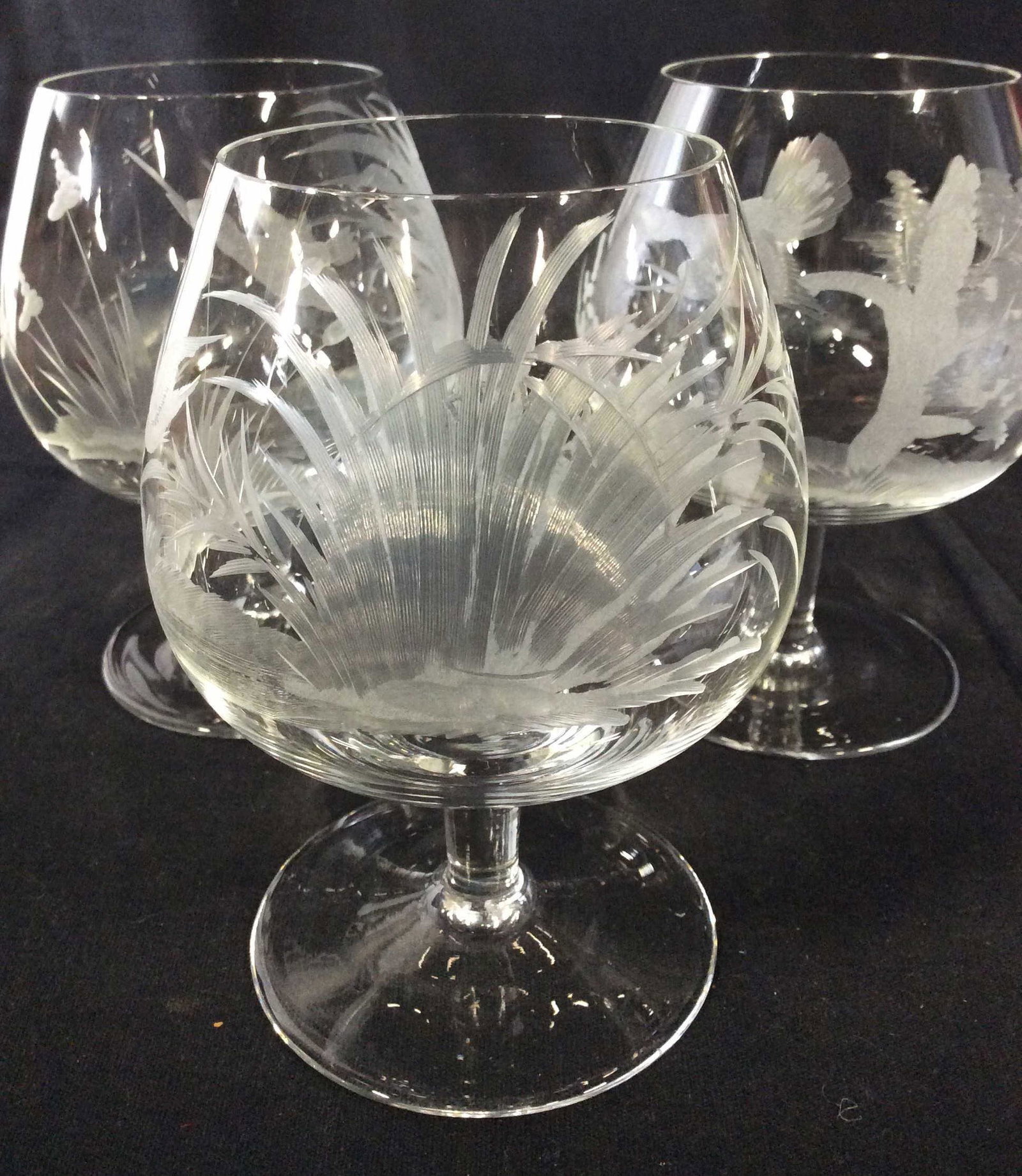 Set 5 Etched Crystal Brandy Snifters: Crystal brandy Cognac Snifters with wildlife hand etched frosted glass- birds, deer, Marsh, hummingbird are some designs. Lightweight, Possibly vintage. App 5 in tall, 3.5 in wide. Hand Formed Crystal