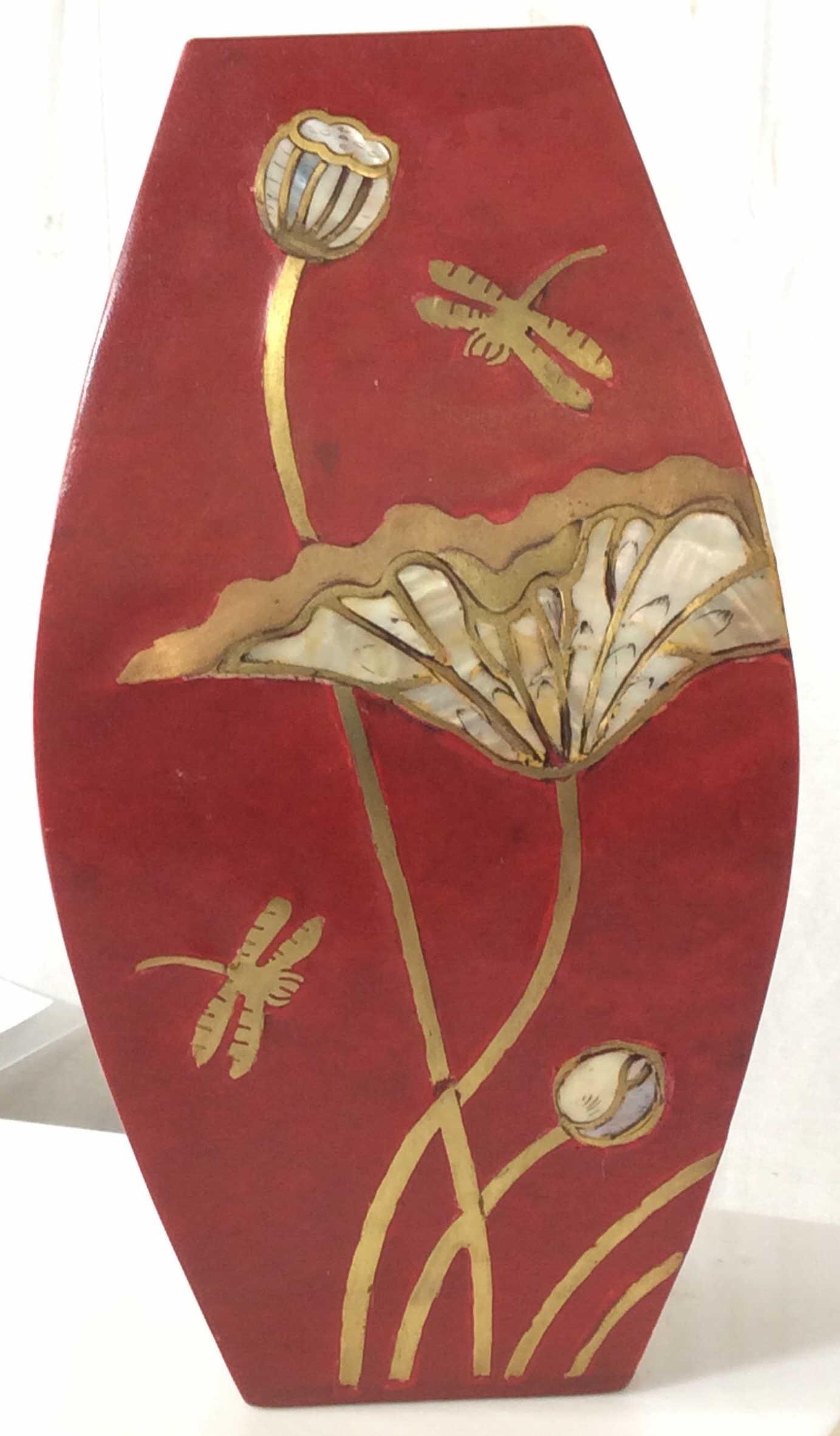 Ceramic Mother Of Pearl Dragonfly Ceramic Vase: Inlaid Mother Of pearl on Gilt floral decor, dragonfly motif accents on all sides, Label on underside reads hand made & Made in Vietnam. App 10 in ht, 5 in width. Arts & Crafts Vintage Vietnamese Vase