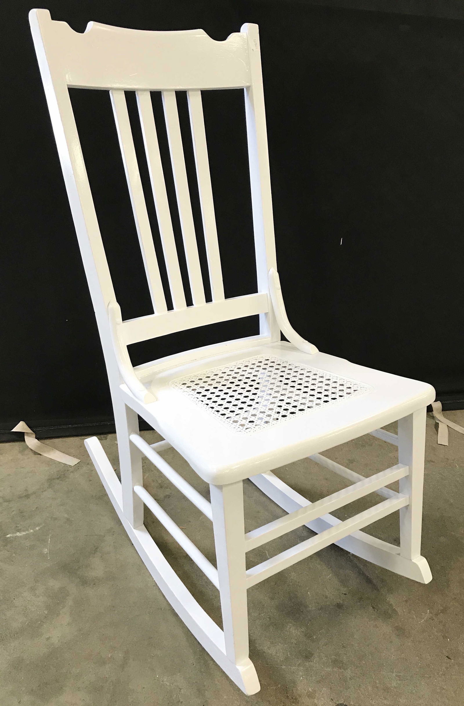 Antique Oak Caned Rocking Chair C 1900’s: Rocking chair is antique circa 1900’s. Piece appears to be oak. Chair is white toned. Piece has caned seat. Chair has been restored. Antique chair, wooden chair, antique rocking chair, rocking chair