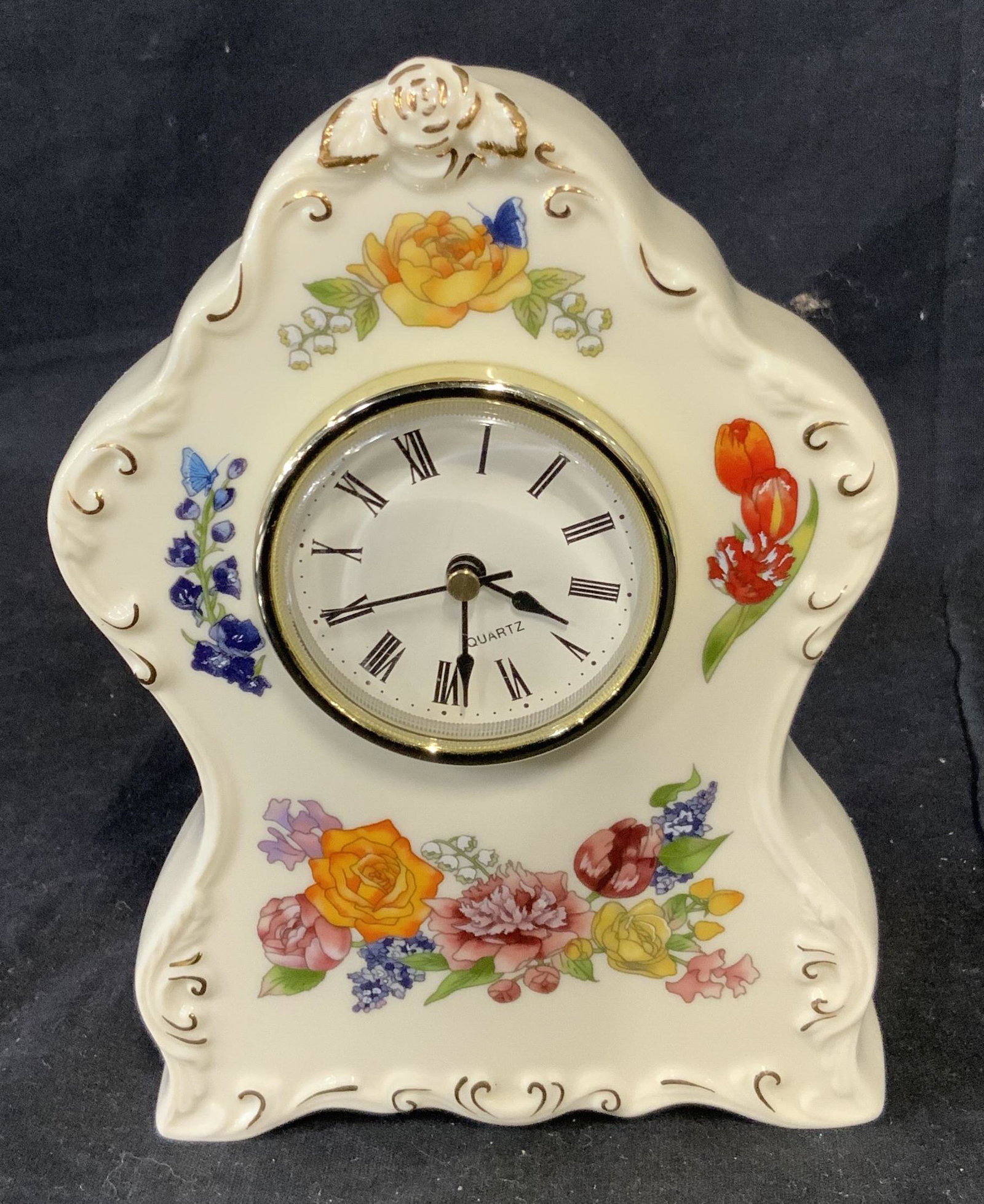 Antique Quartz and Ceramic Base: Antique clocks with Quartz face, additionally the body of the clock is ceramic with floral paintings around the face and body of the clock with some additional gold paint detailing, clock is removable