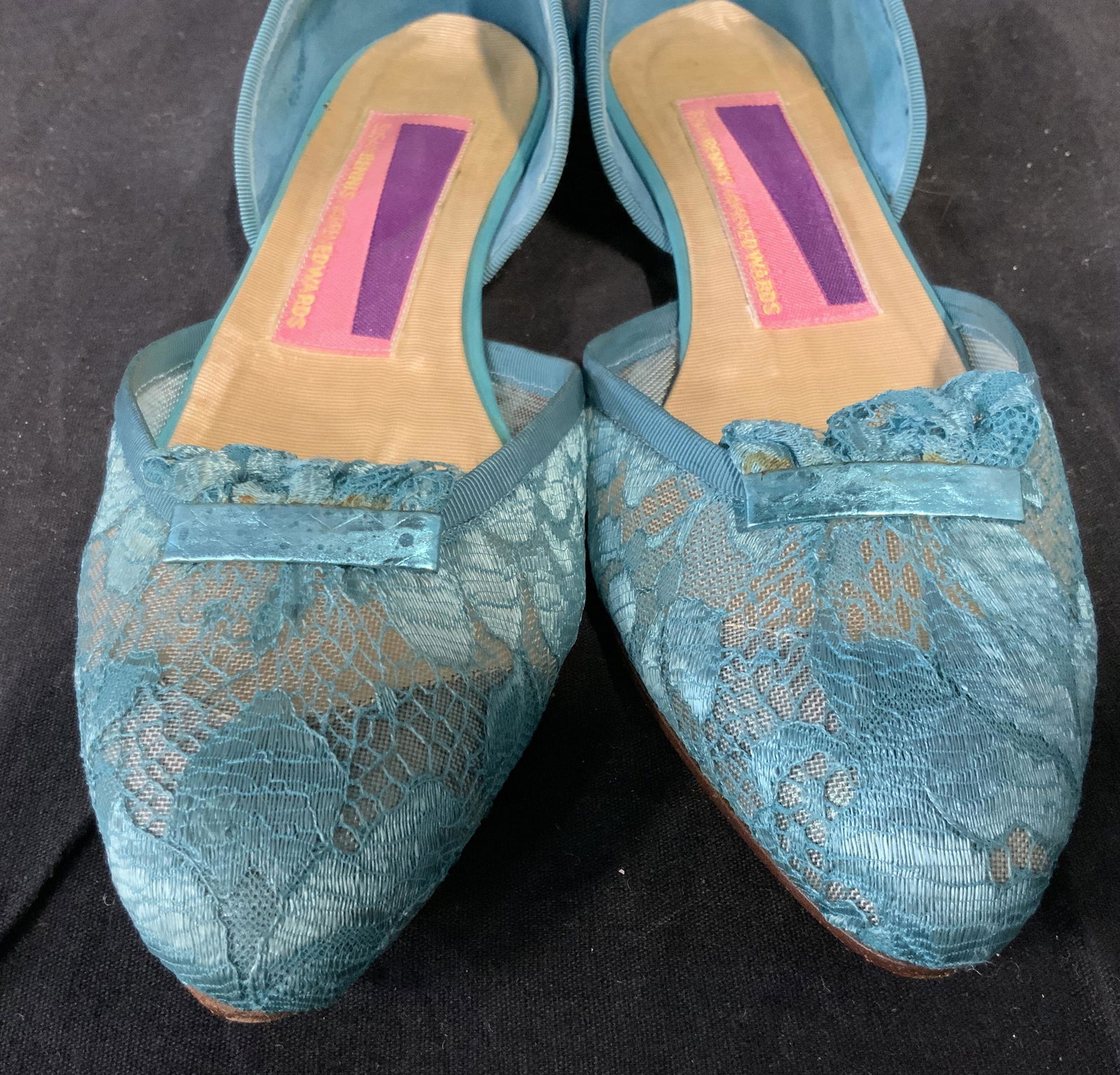 Susan Bennis Warren Edwards Flat Shoes: Susan Bennis Warren Edwards Flat Shoes In bright turquoise, multi fabric, by the toes the top structure is made of lace with a lace made bow at the toes while the backside of the shoe is made of a shi