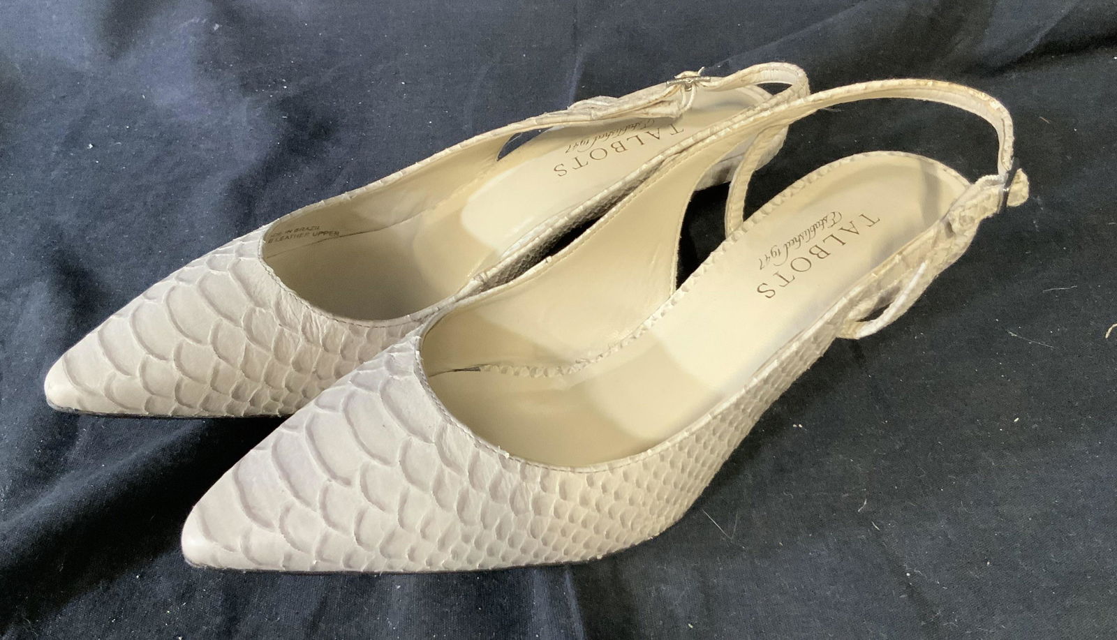 Pair of Talbots Sling Back Dress Shoes: Pair of Talbots Sling Back Dress Shoes, this pair comes in a tan faux snake print, tan so they fit tons of occasions with plenty of options to go with them, these shoes are a size 8 and the heel is an