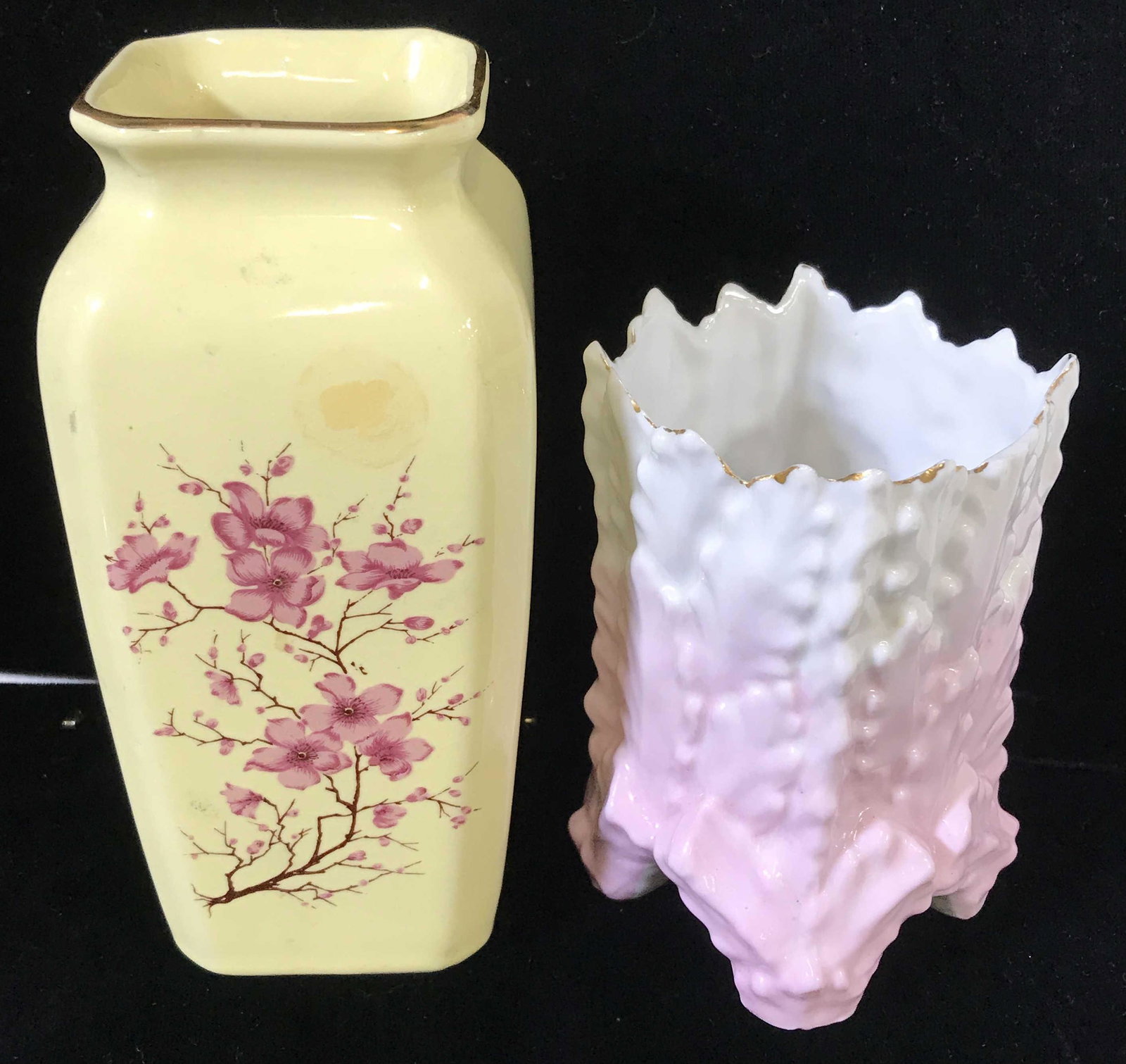 Lot 2 Decorative Porcelain Vases: Hand painted Cherry blossoms on yellow glazed vase, underside with sticker reads Hand Crafted in Taiwan. 6 1/8 in ht. 2 3/4 in width. Embossed leaf pattern vase, jagged Rim. Thin walled porcelain. Tab