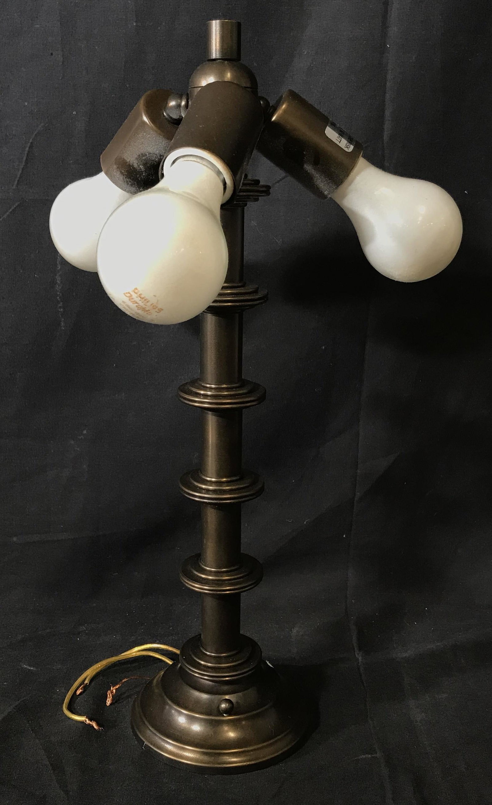 Three Bulb Metal Lamp: Three bulb metal lamp, brass toned metal, exposed copper wiring at the bottom, measures 17 inches at tallest point, Lamp, metal lamp, brass toned metal, umbrella lamp, lighting, desk lamp, table lamp,