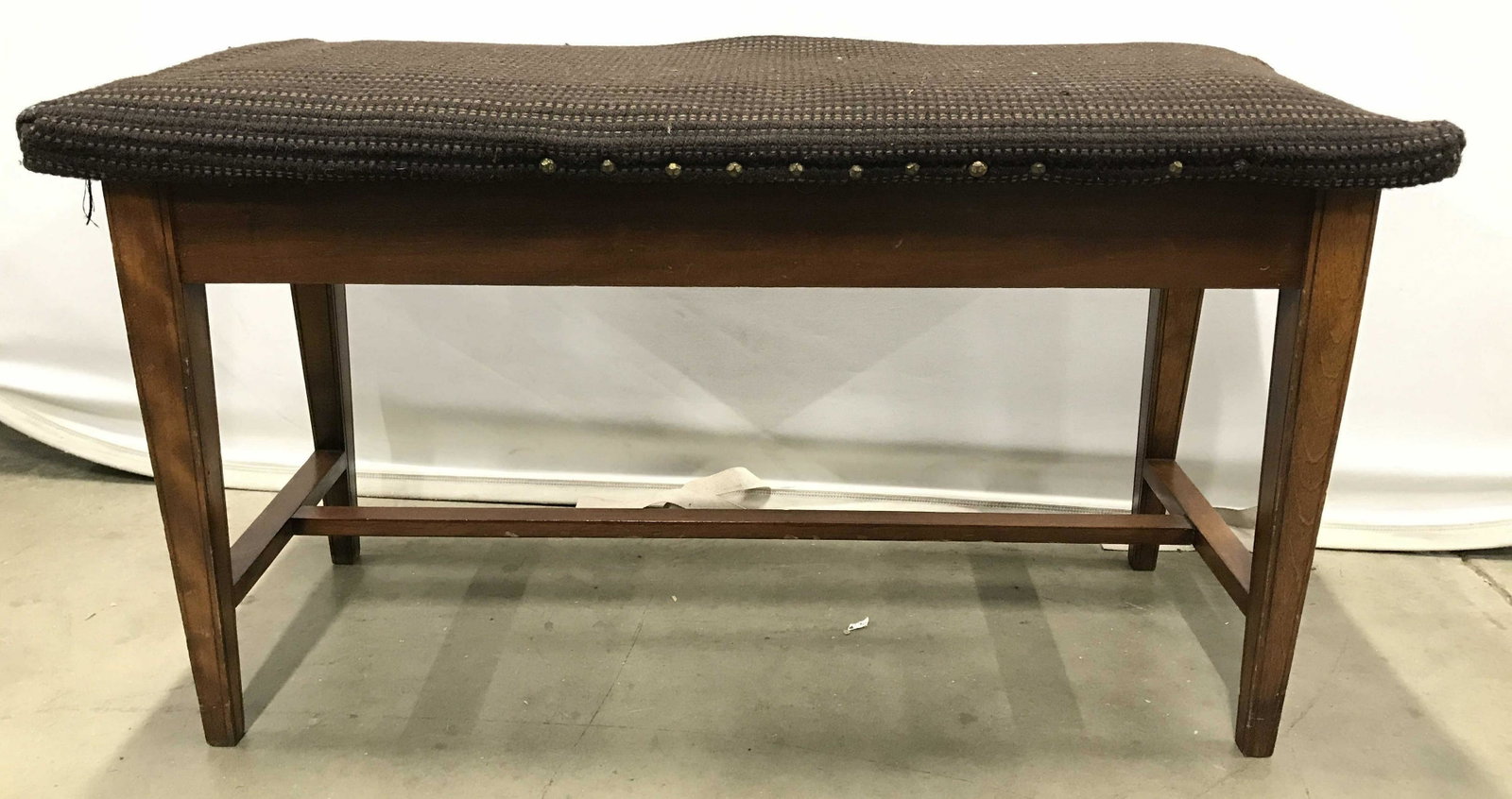 Vintage Carved Wooden Storage Bench: Seat of bench is upholstered. Seat flips open to reveal storage area. Legs of bench have stretchers in between. Bench, vintage bench, storage bench, piano bench, living room furniture, Upholstered ben