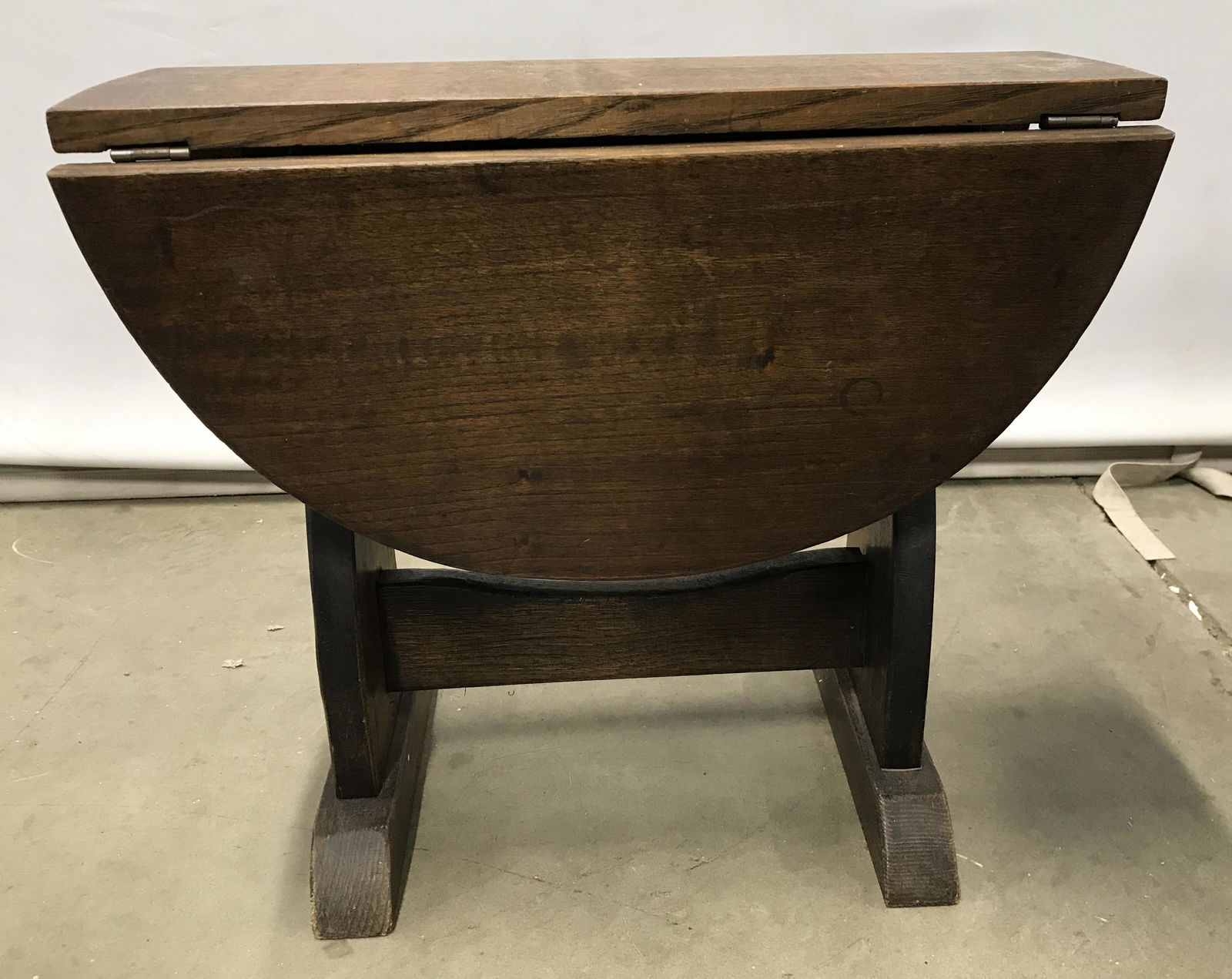 Vintage Petite Wooden Drop Leaf Tabletop: Drop leaf table is wooden. Piece is vintage possibly antique. Piece is possibly hand crafted. Table appears to be children’s sized, Measures approximately 17 inches tall 22 inches long 19 inches dee