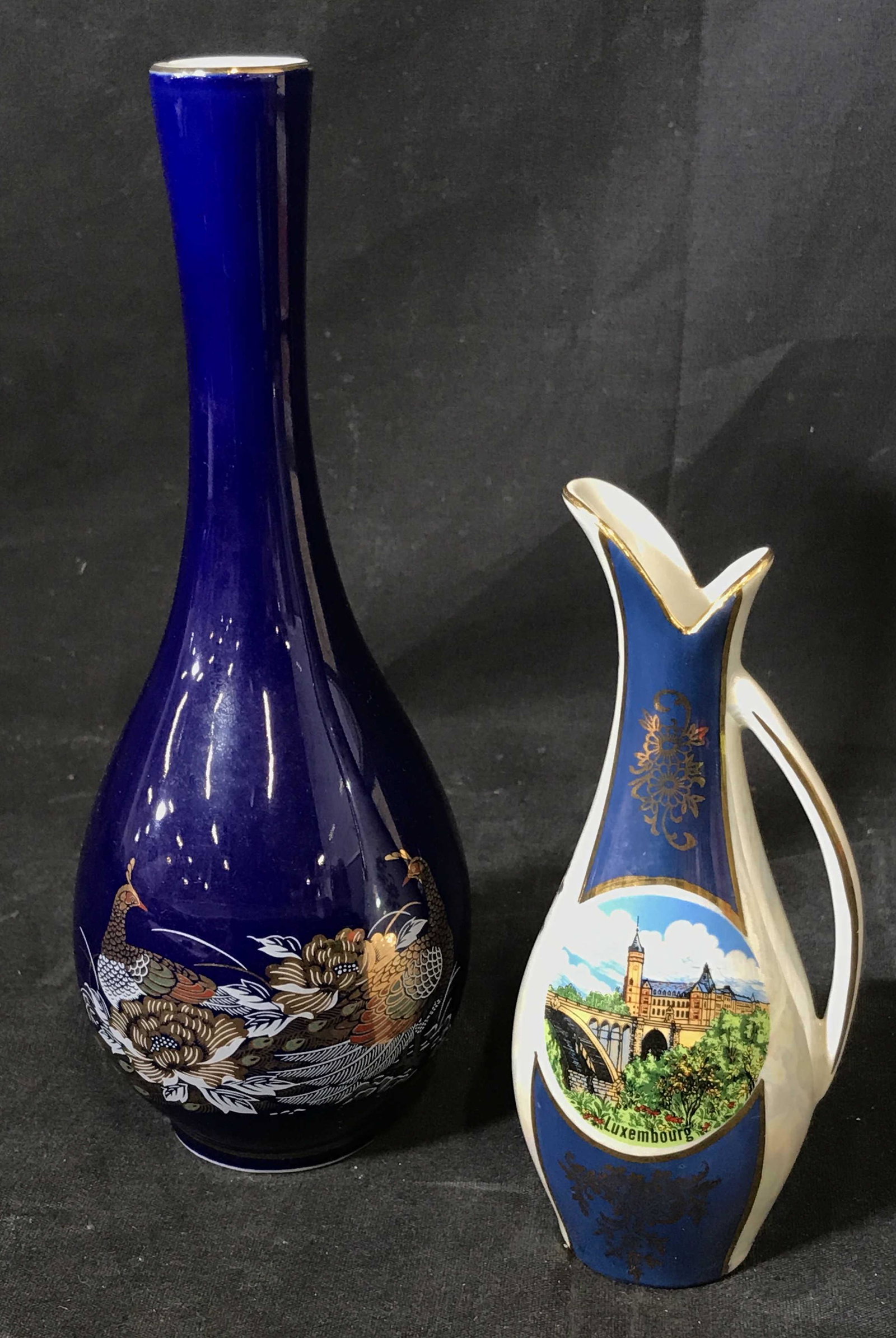 Pair Miniature Porcelain Vases: Pair Miniature Porcelain Vases, one is made of a colt bolt blue with two pheasants in white and gold, one is an opalescent Pearl with a picture of Luxembourg and sections of blue with gold designs, ta
