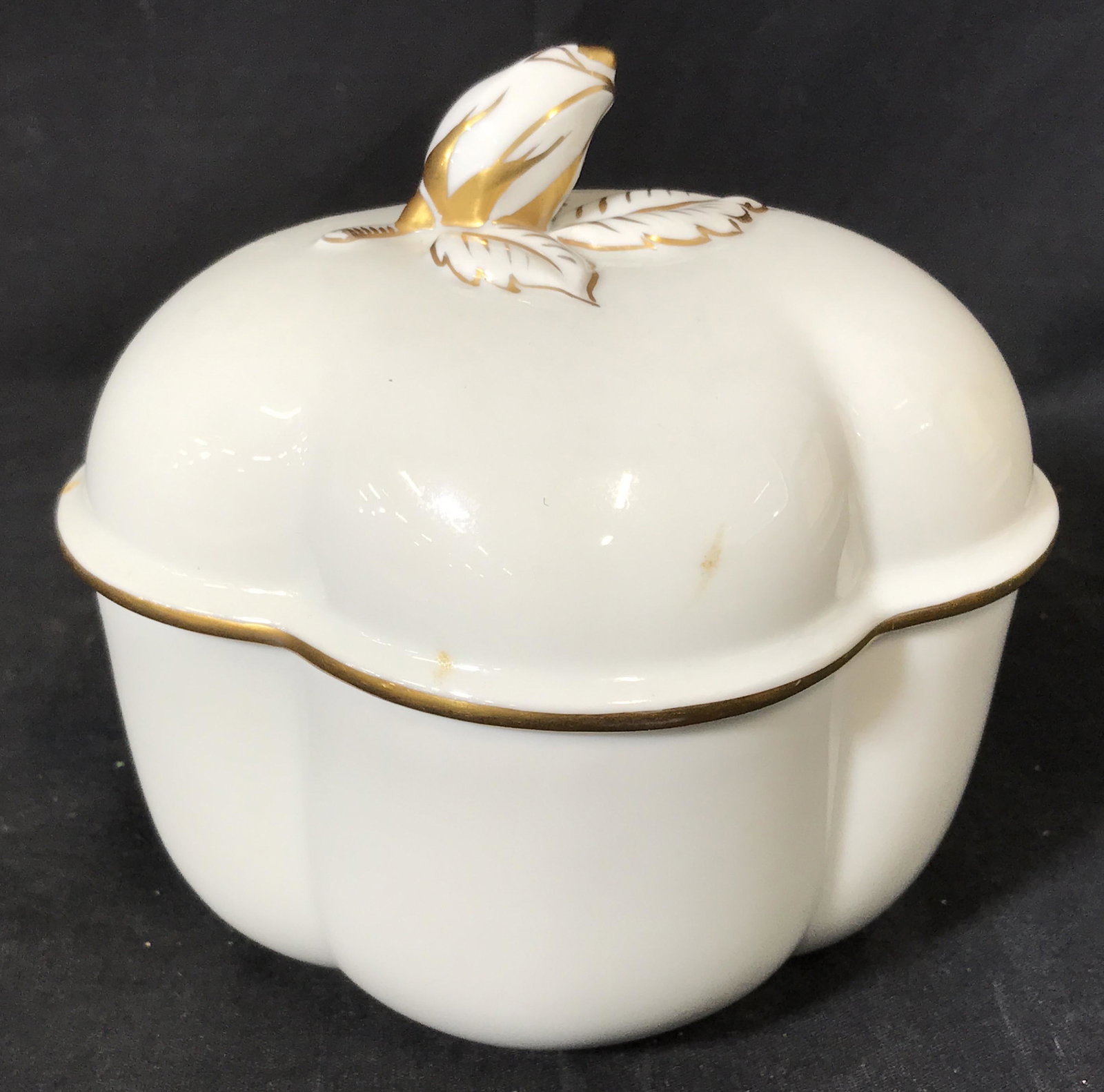 Limoges Porcelain Lidded Vessel: Limoges Porcelain Pumpkin pot, bottom of pot reads ‘Limoges France’, pot resembles a pumpkin and has gold embellishments, some stains to surface, measures 6 inches at tallest point, Limoges, Frenc