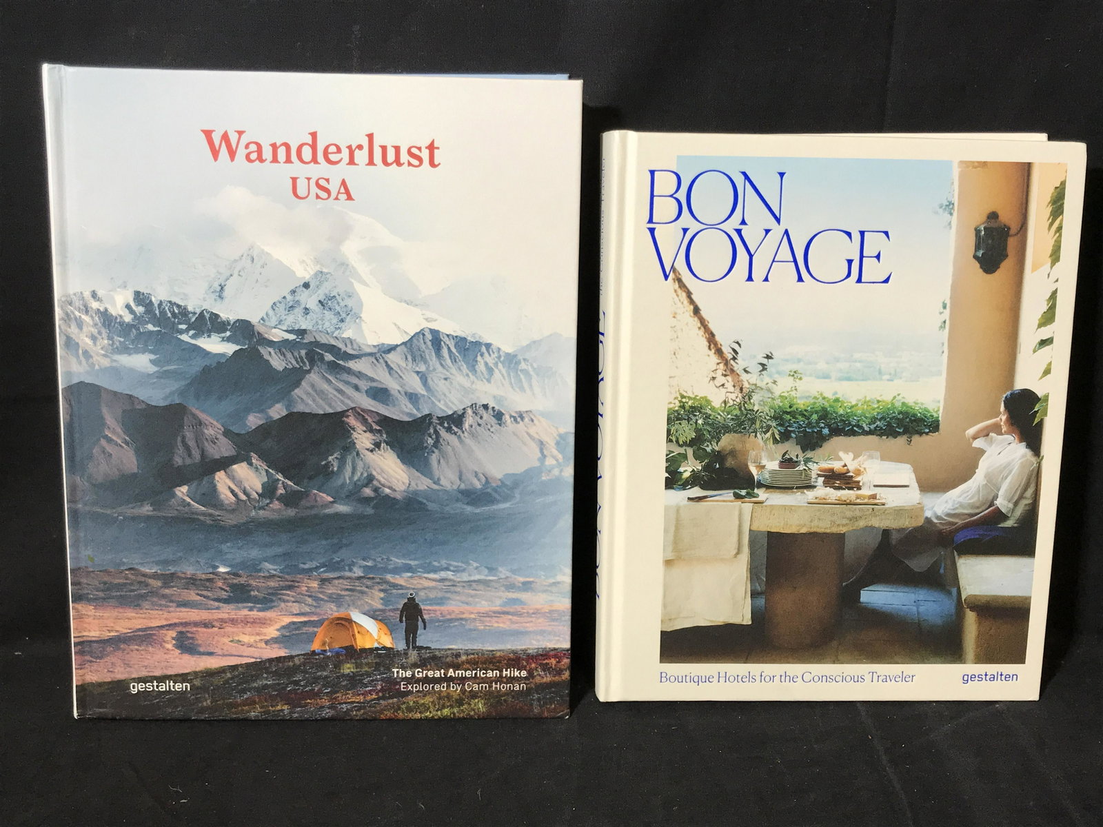 Set of New Coffee Table Books On Travel: Set of 2 new coffee table books on Travel, titles include ‘Wanderlust USA: The Great American Hike’ and ‘Bon Voyage: Boutique Hotels for the Conscious Traveler’, largest book measures 11.75 in