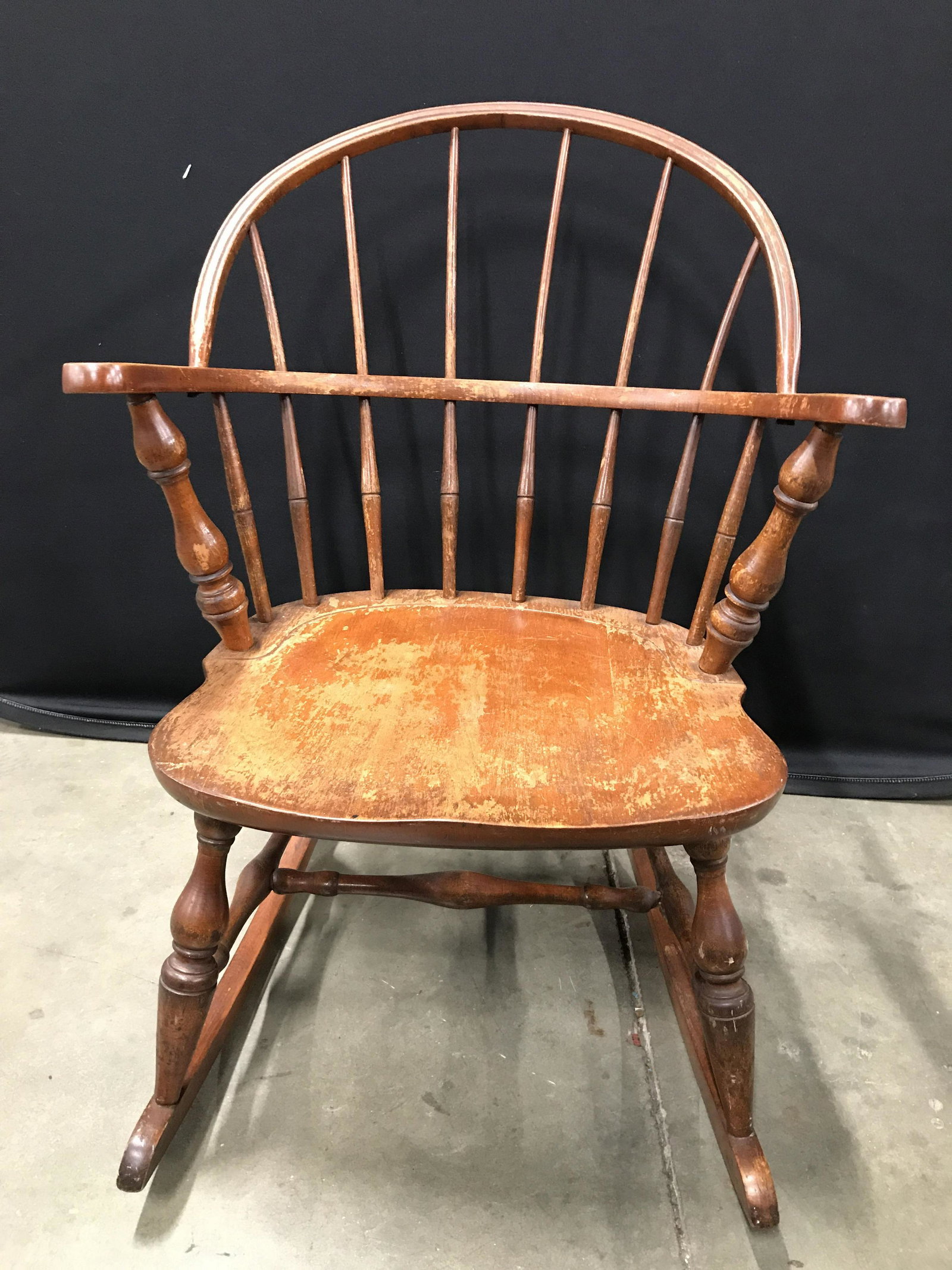 Vintage Barrel Spindle Back Rocking Chair: Rocking chair is wooden. Piece is vintage possibly antique. Chair has spindle backrest with barrel shape. Piece is possibly hand crafted. Rocking chair, wooden rocking chair, vintage rocking chair, sp