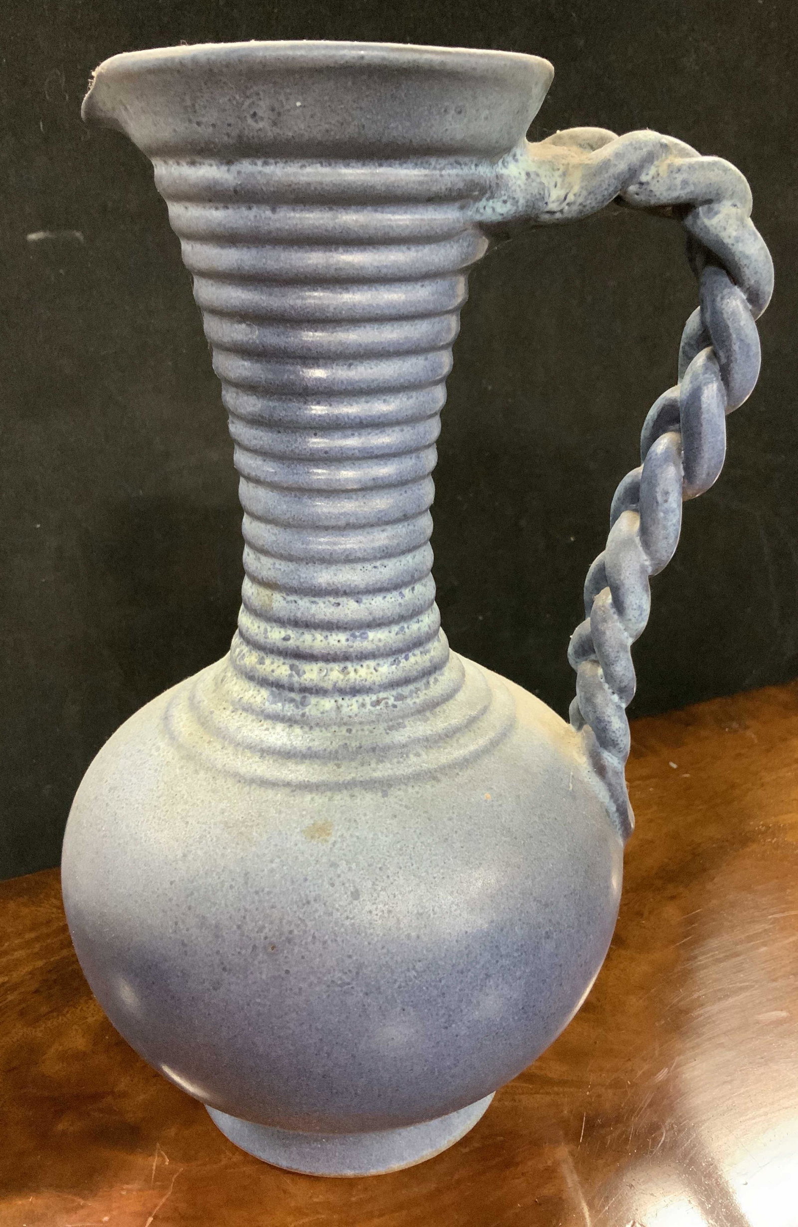 Vintage Signed Blue Ceramic Footed Pitcher: Hand made vintage ceramic, pottery vessel, pitcher, ever, vase, decorative accessory, ribbed neck braided handle, measures ht 9.5 inches, signed illegibly on underside