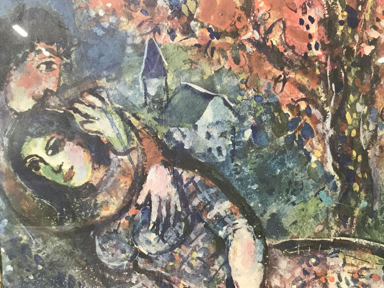 Artwork Print of Marc Chagall: Reproduction Artwork print of Marc Chagall painting, subject an abstract scene of a man and woman lying beneath a tree with animals around them, glass frame held together at the corners, measures as a