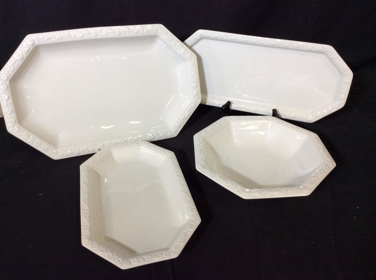 Set 4 ROSENTHAL Porcelain Server Ware, Germany: Octagonal Porcelain Bowl And 3 Serving Platters. Embossed rim. Stark White. all Hallmarked ‘Rosenthal Germany’ largest Tray 15 x 9.5 in. Slight chip to embossed pattern, med. Tray. Fine Porcelain 