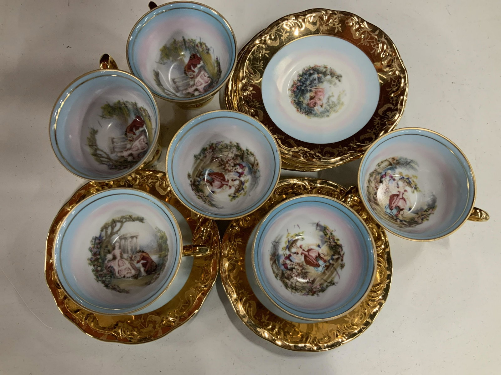 Set 6 Hand Painted Porcelain tea cup saucer Set: Porcelain tea cup and saucer Set , each exterior builder with floral design, inside painted Victorian garden scenes, each saucer garden scene and gilt rimmed, ht app 3 inches, tea service tea set, tab