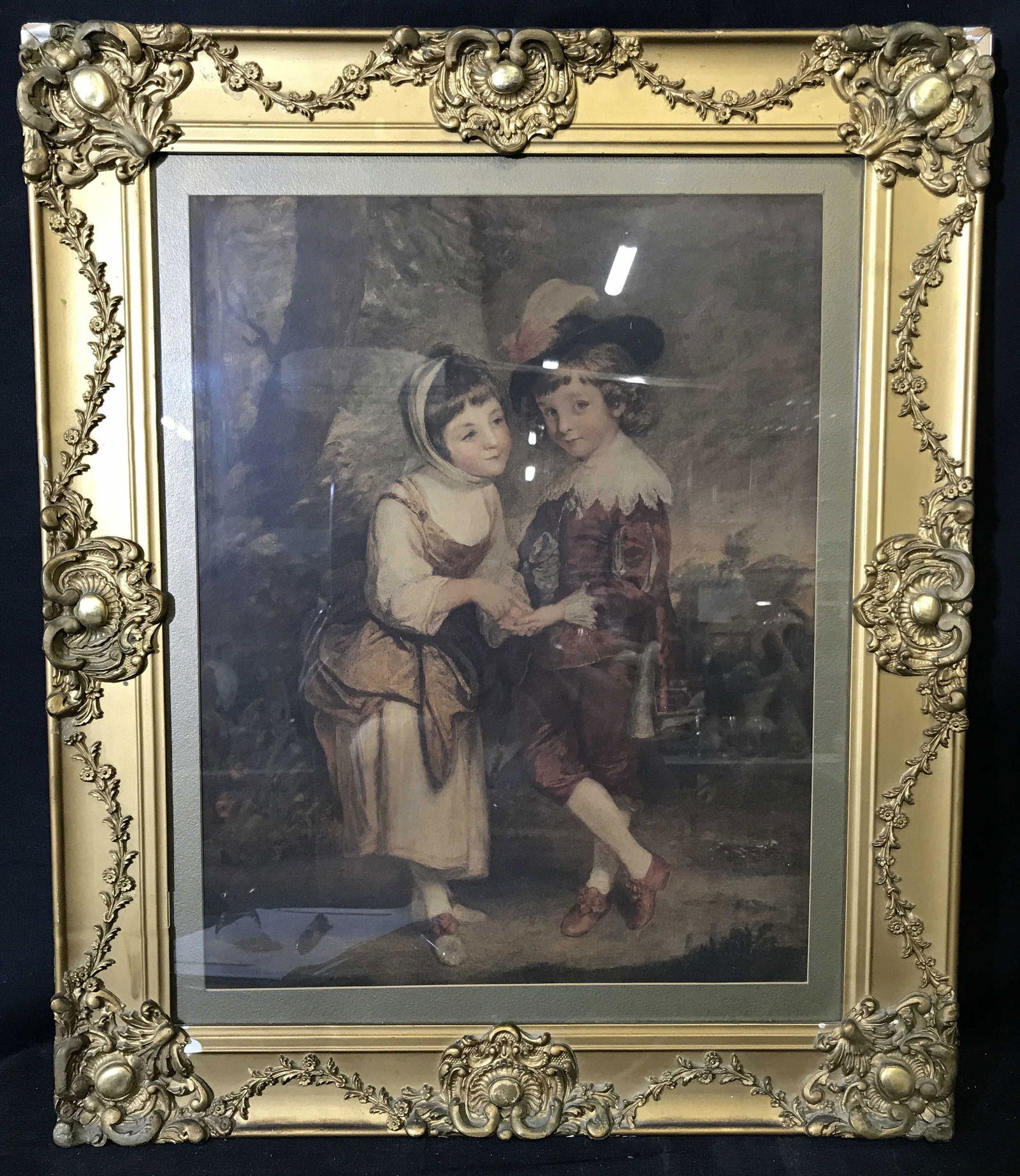 Medieval Style Lithograph Portrait Gilt Wood Frame: Medieval style lithograph portraiture, no apparent signatures or stamps, subject two children in medieval garb in a rural setting, Grey matting, gilt wood frame, measures 24.75 inches tall by 20.25 in
