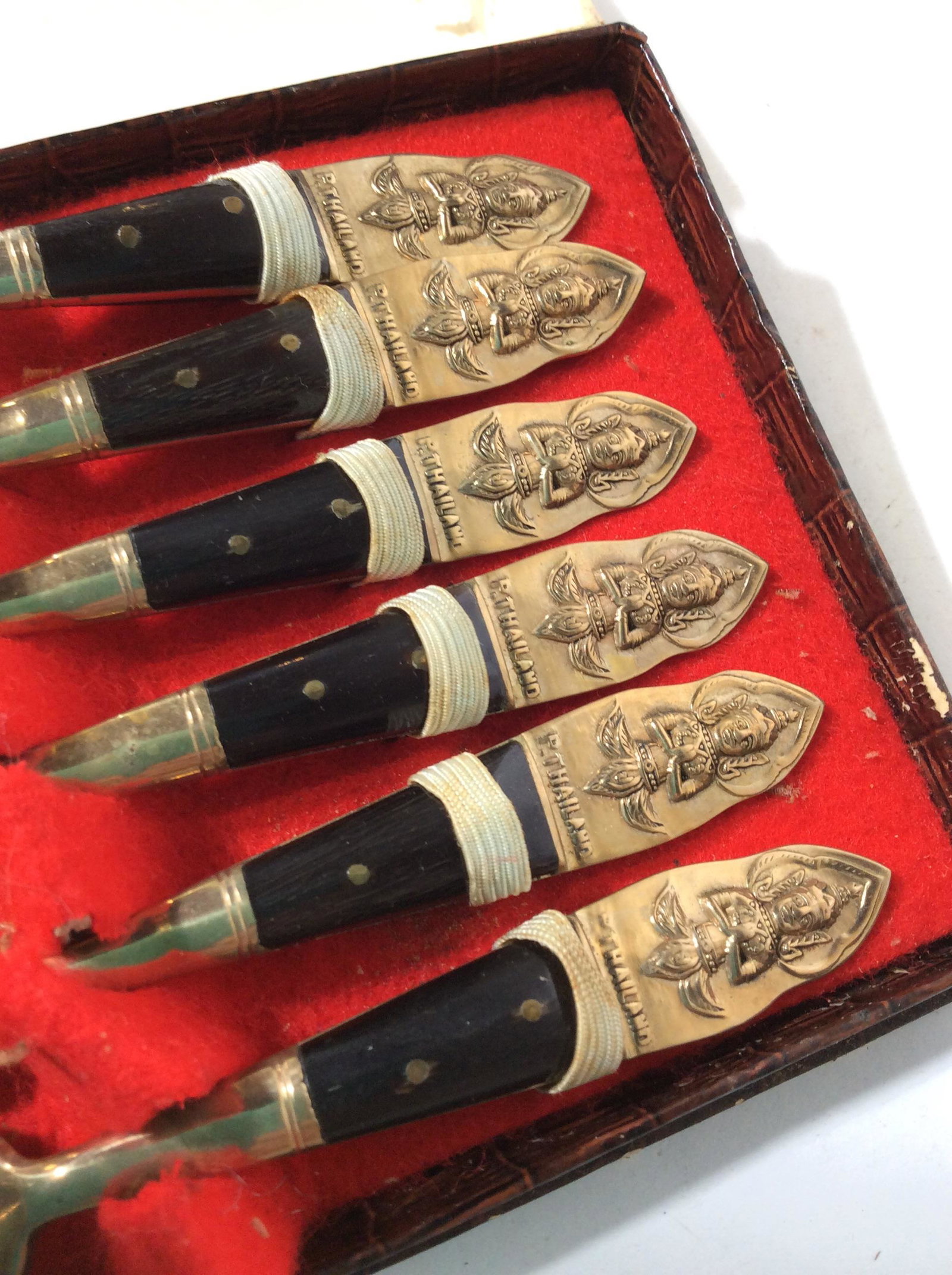 Vintage Set 6 Thailand Cocktail Forks Original Box: 2 prong cocktail forks in box. Embossed Prayer Diety on handle, Gold Tone Metal & composite. 4.5 in long. Good vintage condition, 1 chip to composite on 1 fork. Marked P. Thailand. Thailand, Praying D