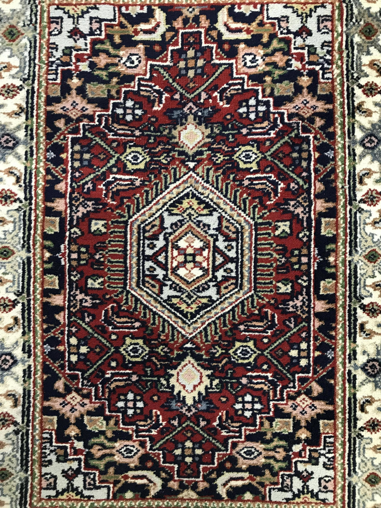 Vintage Handmade Prayer Size Fringed Rug: Rug is handmade and wool. Piece is vintage. Rug contains multi toned geometric detail. Rug, carpet, area rug, wool rug, handmade rug, vintage rug, petite rug, prayer size rug. textile arts and crafts,