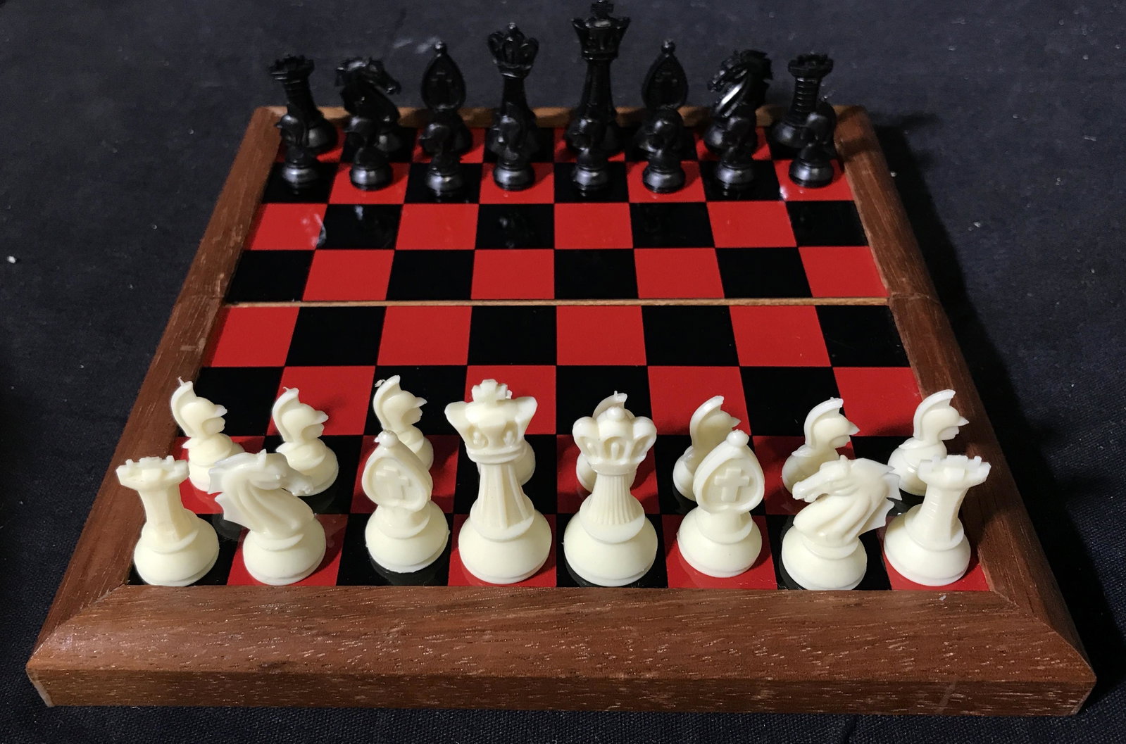 Portable Magnetic Chess and Checkers Board: Portable magnetic chess and checkers board, box sealed with a magnetic strip, box opens up to a chess/checkers board, inside the box are chess pieces and checker pieces in separate bags, board measure