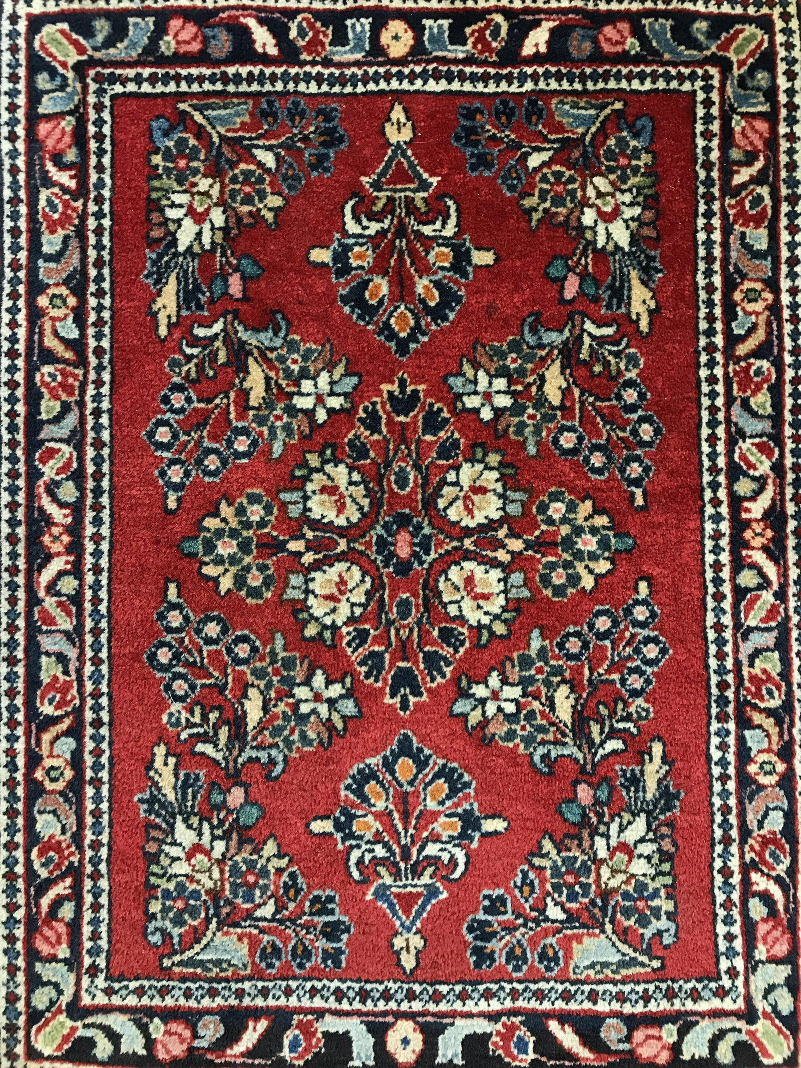Vintage Handmade Floral Detailed Wool Rug: Rug is wool and handmade. Piece in vintage. Rug contains multi toned floral leaf and vine detail. Rug, carpet, area rug, wool rug, handmade rug, vintage rug, floral rug. textile arts and crafts, home 