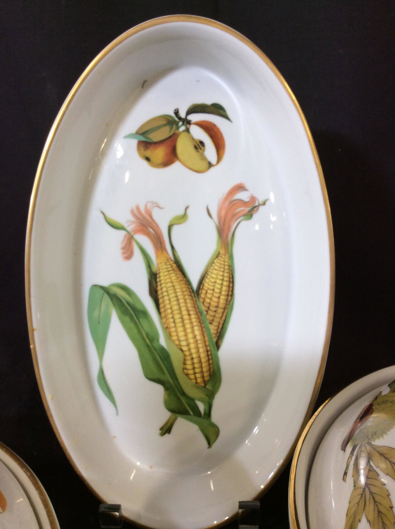 Royal Worcester Evesham Stoneware Set, 3 pcs: Oven to table Stoneware or Freezer to oven, with fruit and vegetable decor. All Hallmarked. 1 side dish bowl with Gilt rim, 12 1/4 x 12 1/4 in. Lidded Side Dish with steam hole, 11 x 7.5 in. Deep cass