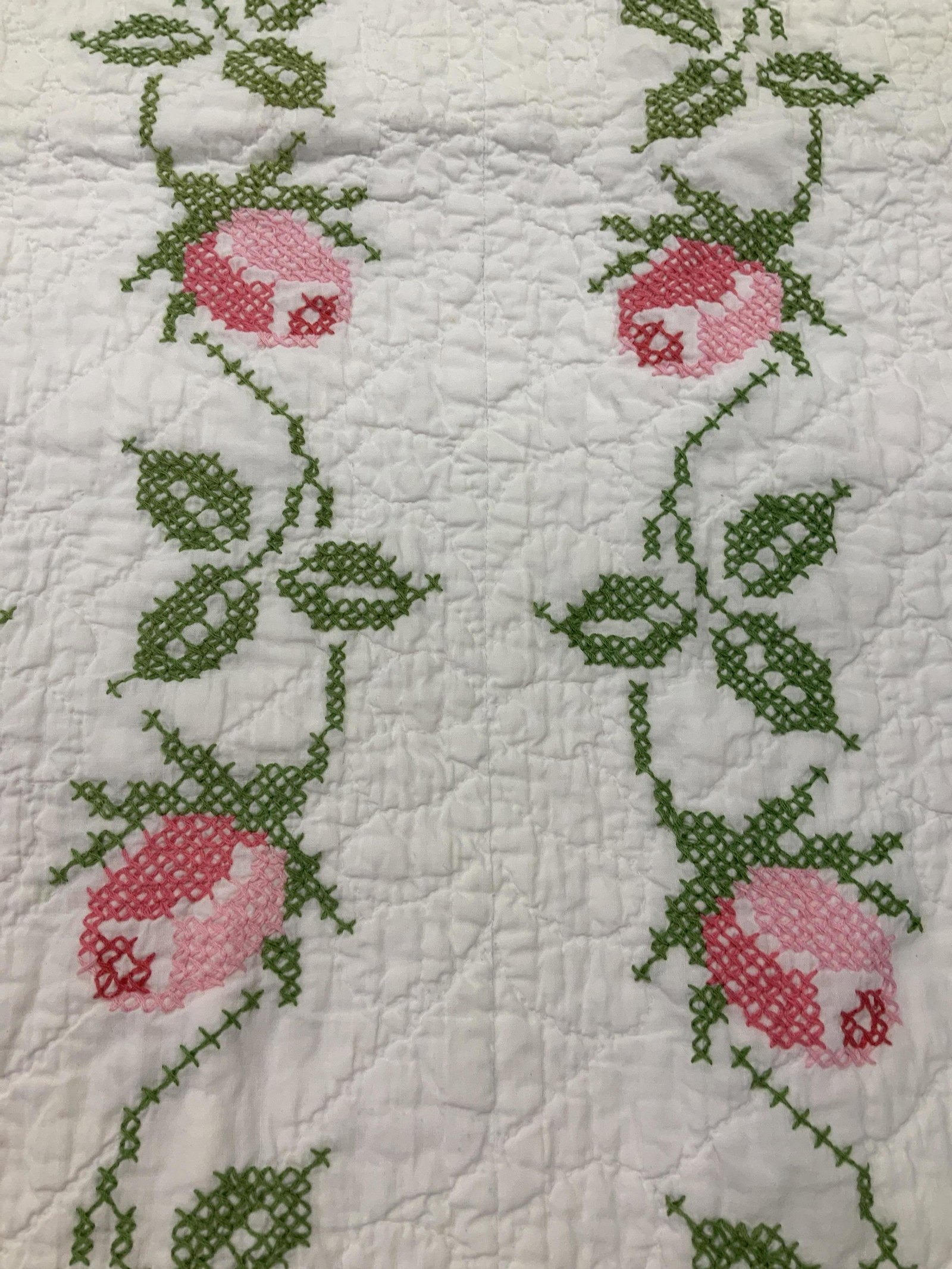 Vintage Quilt with vines and roses: White quilted bed covering with stitched green vines and pink roses, quilt measures app 60 inches by 66 inches app, vintage linens, vintage quilt, collectible, some wear