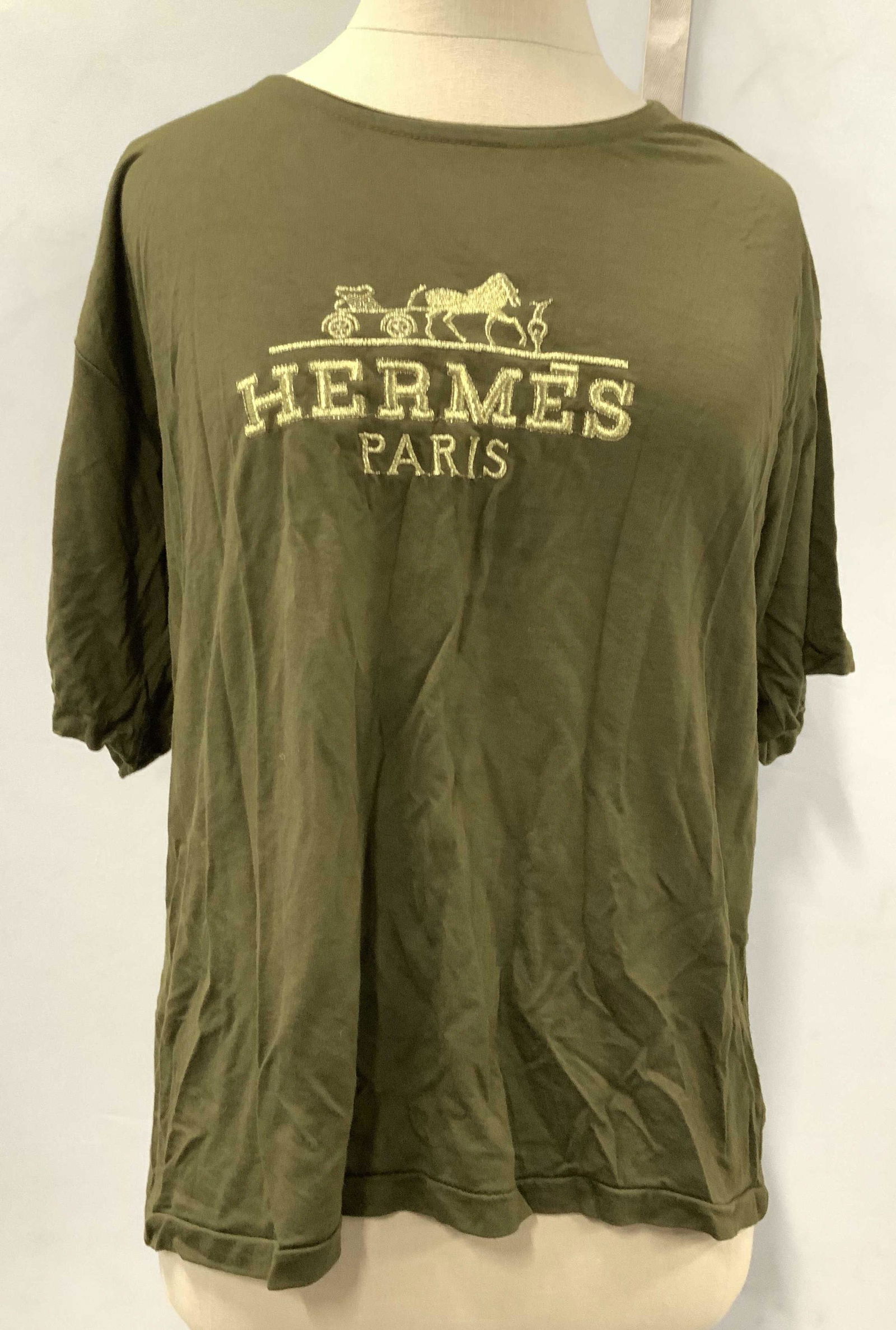 HERMÈS , Paris, Green and Gold fashion Shirt: Soft cotton T style top, with gold embroidery Hermès and iconic horse logo, label inside shirt for Hermès, fits size medium, short sleeves, luxury French fashion, luxury French designer wearable, He