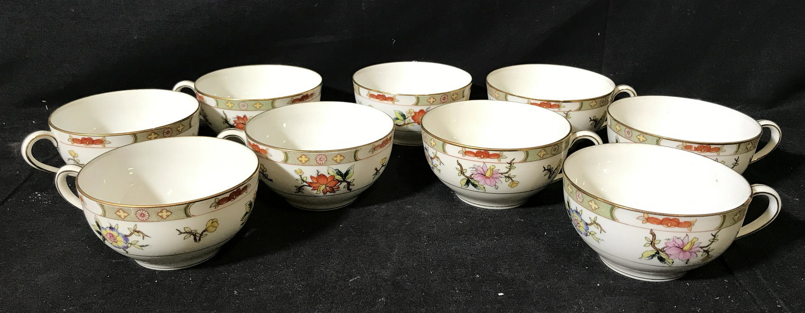 9 Noritake Japanese Porcelain Cups & Saucers: 9 Noritake Japanese Porcelain Cups &Saucers , bottom of each is stamped in green and reads ‘Noritake Nippon’, Nippon being the Japanese word for Japan, each is a milk white porcelain with floral d