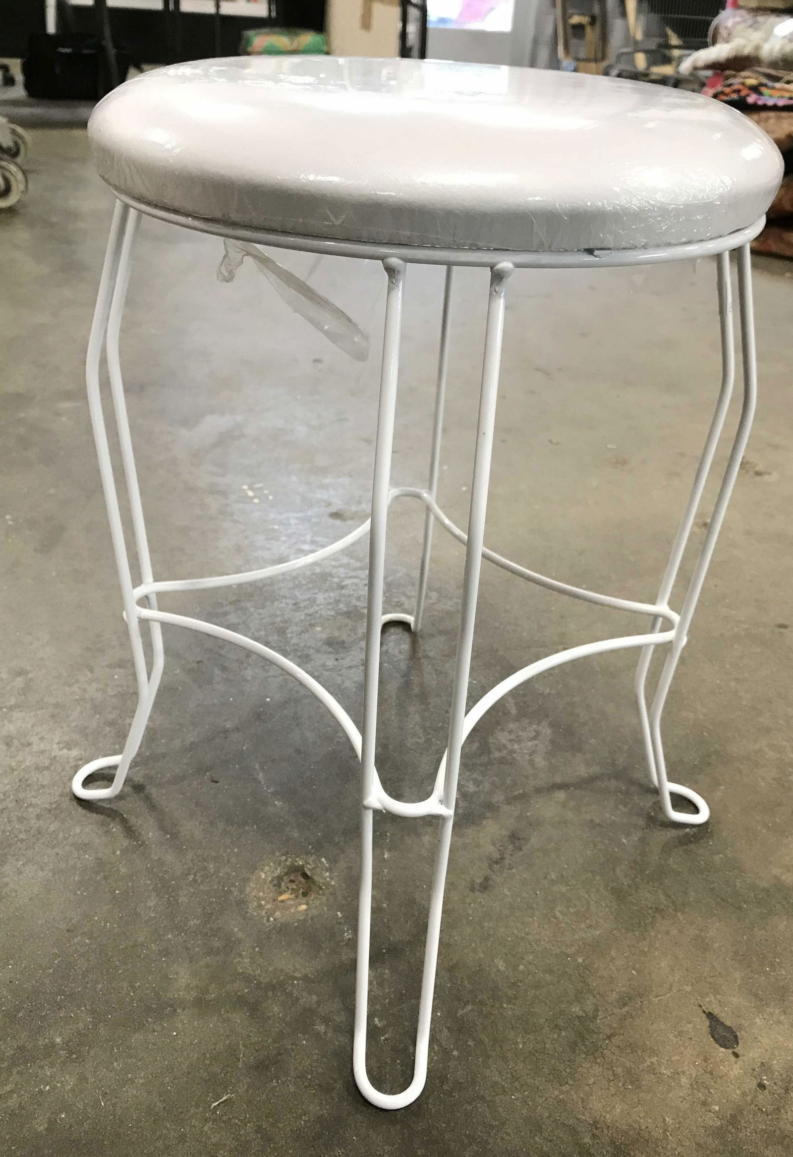 COLUMBIA Frame Inc Stool: Tag on underside READS COLUMBIA FRAME INC. Stool appears to possibly be vintage. Piece is white toned. Seat cushion is possibly leather. Piece has 4 white toned metal Legs. PIECE measures approximatel