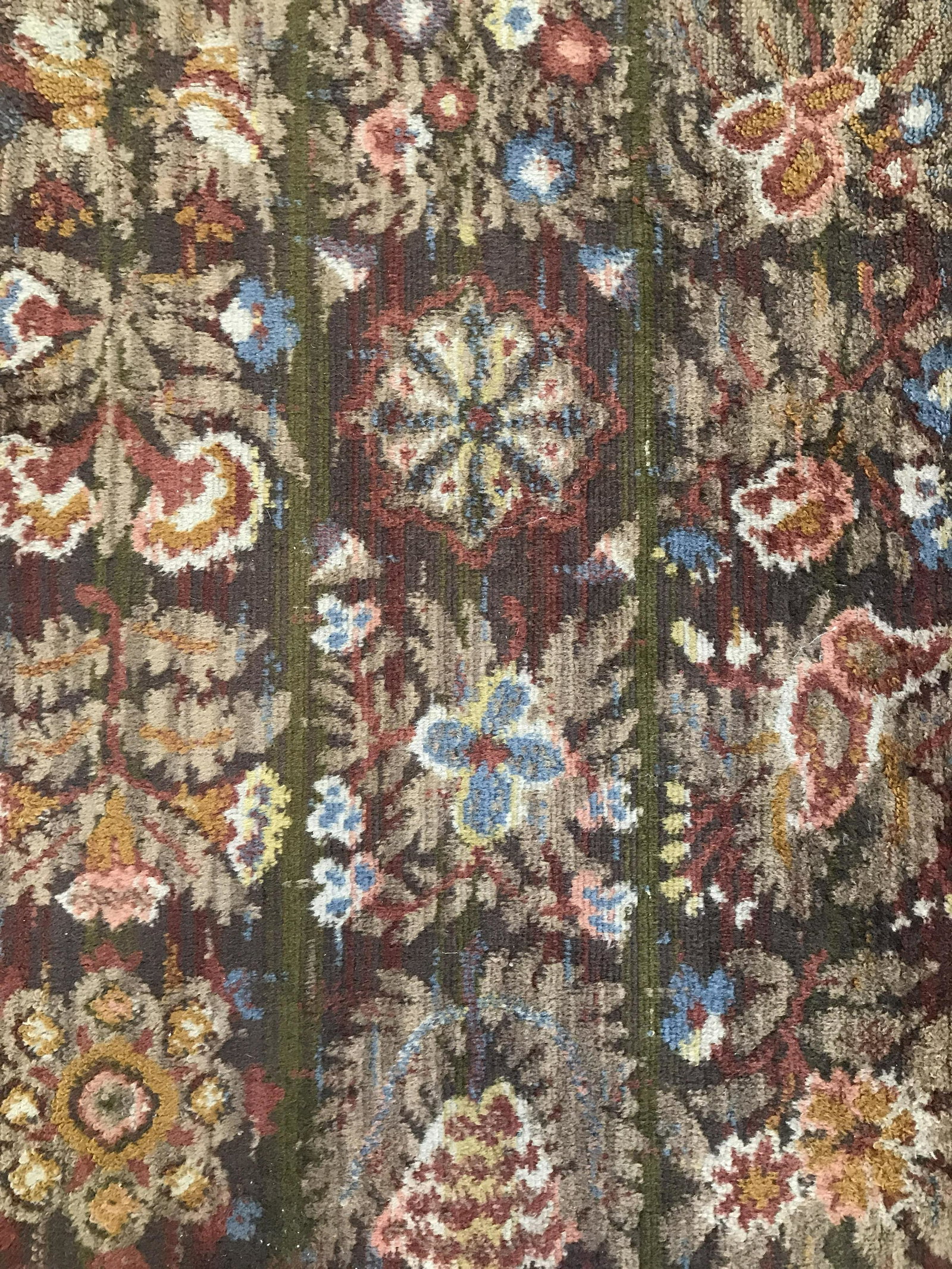 Antique Petite Handmade Wool Rug: Rug is wool and handmade. Piece appears to be antique. Rug contains multi toned floral detail. Rug, carpet, area rug, wool rug, handmade rug, petite rug, vintage rug, antique rug. textile arts and dec