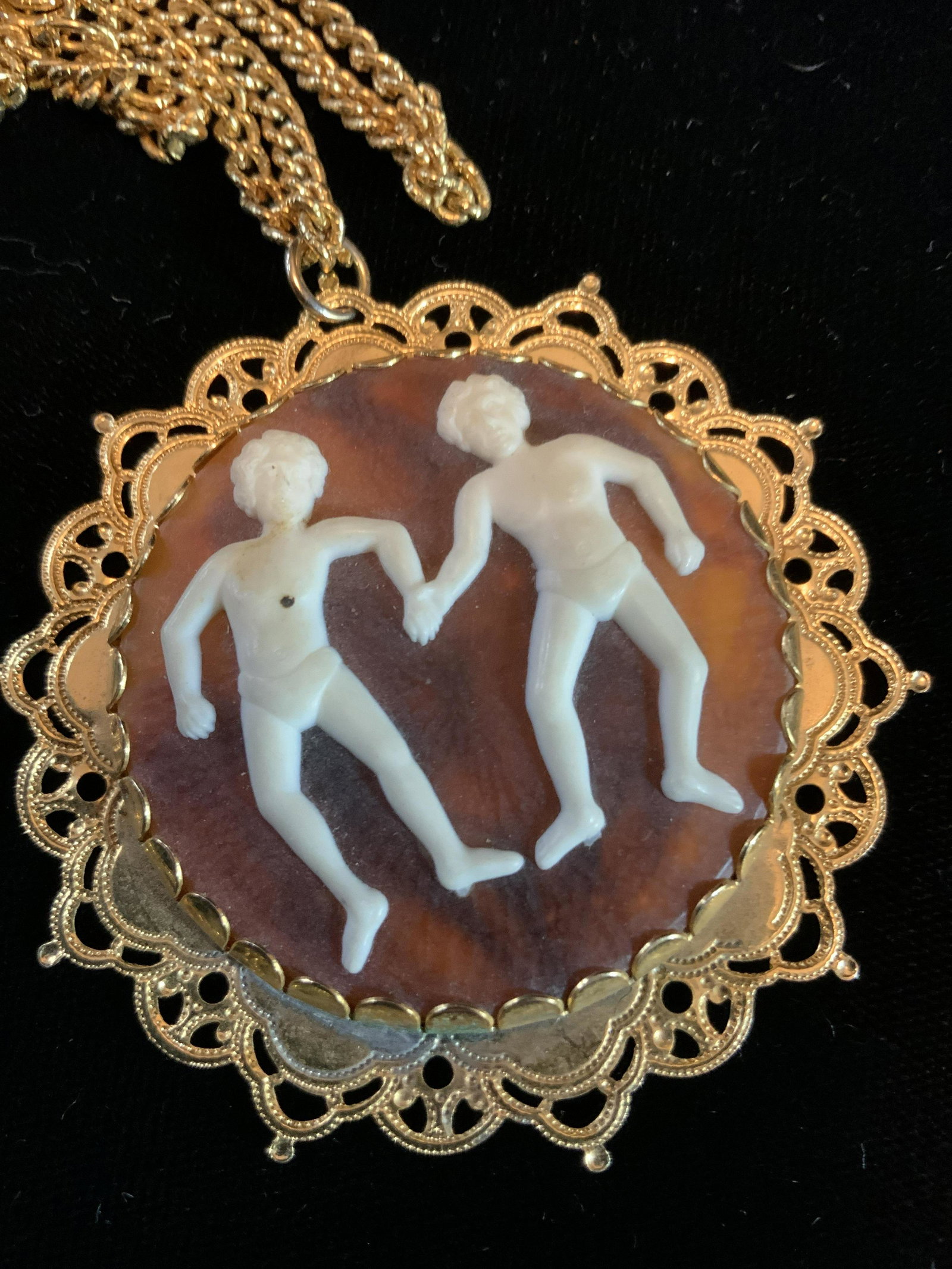 Vintage Pendant Necklace w Figurals in Relief: Gold toned chain with large circular pendants figures in relief, material unknown, diameter app 2.5/inches, possibly Gemini the Twins, jewelry, estate jewelry, ladies wearable fashion accessories