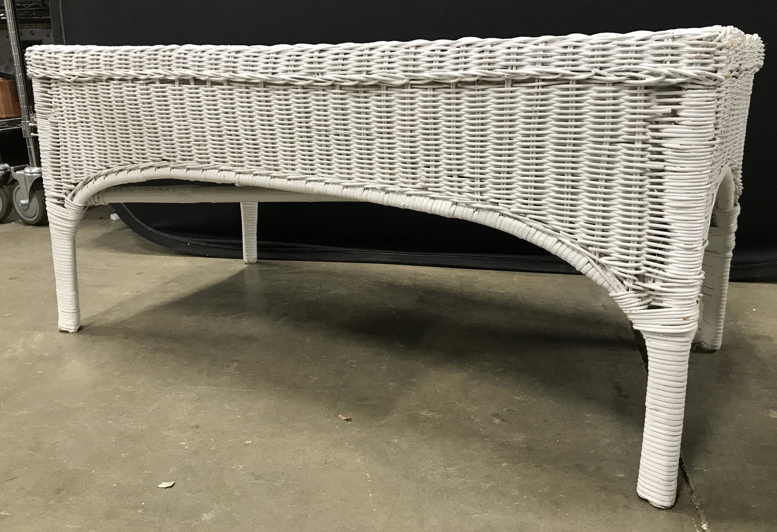 Vintage Outdoor Wicker Coffee Table: Coffee table is white toned and wicker. Coffee table, wicker table, wicker coffee table, bench, wicker bench, outdoor bench. Piece measures approximately 37 inches long 19 inches tall 17 inches deep. 