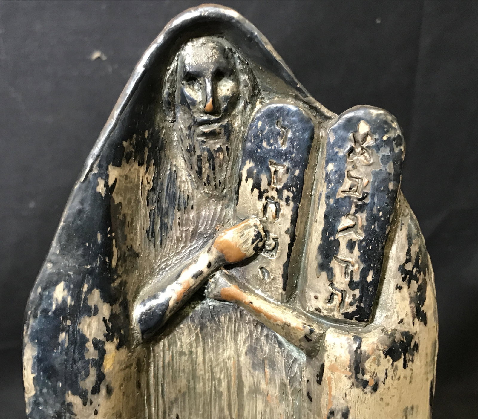 Resin Statue Moses W Commandments: Resin Statue of Moses, illegible signature on the bottom, subject Moses holding the Ten Commandments standing atop a rock, measures 10 inches at tallest point, resin appears in the form of a shell, Re
