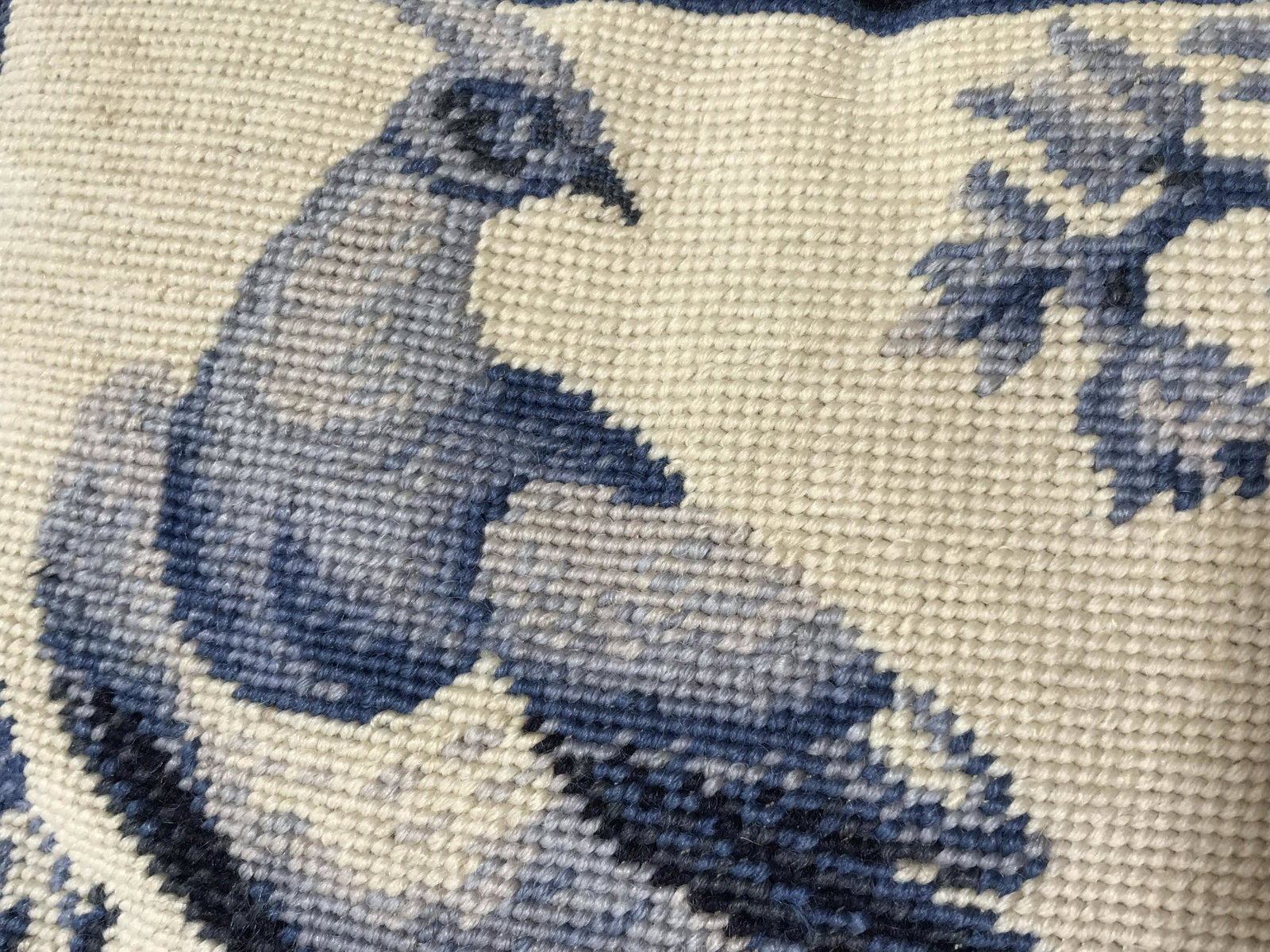 Vintage WILLIAMSBURG Needlepoint Throw Pillow: Depicts a peacock perched on a branch, in varying blue tones. Measures approx 10 inches H, and 16 inches W. Zipper can be found on back, cover is removable. Wear is consistent with use. Throw pillow, 